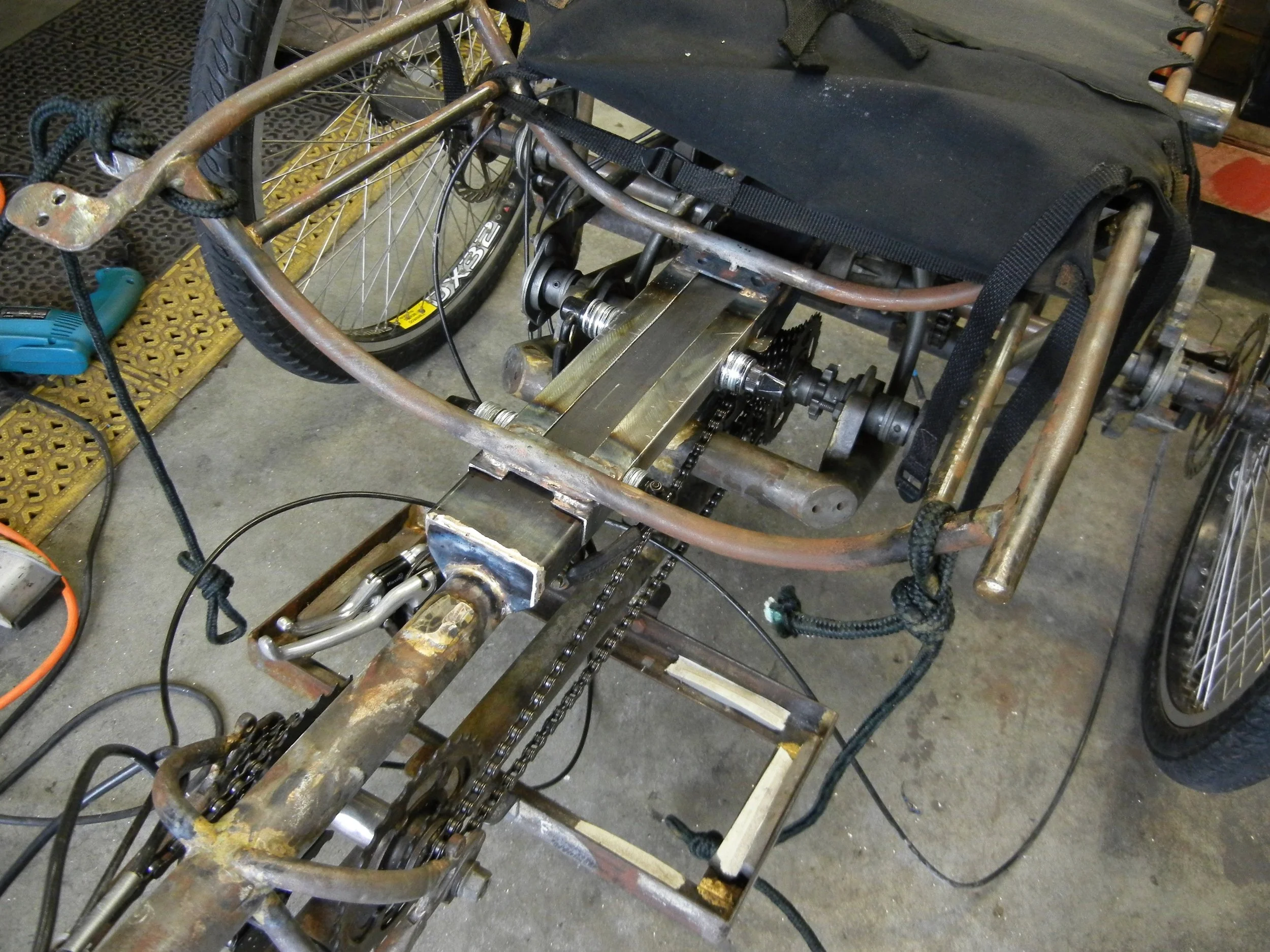  First things first or so I thought. Original seat welded to three one inch tabs to frame, well it busted out the frame. My fix build it burly and they will survive! 