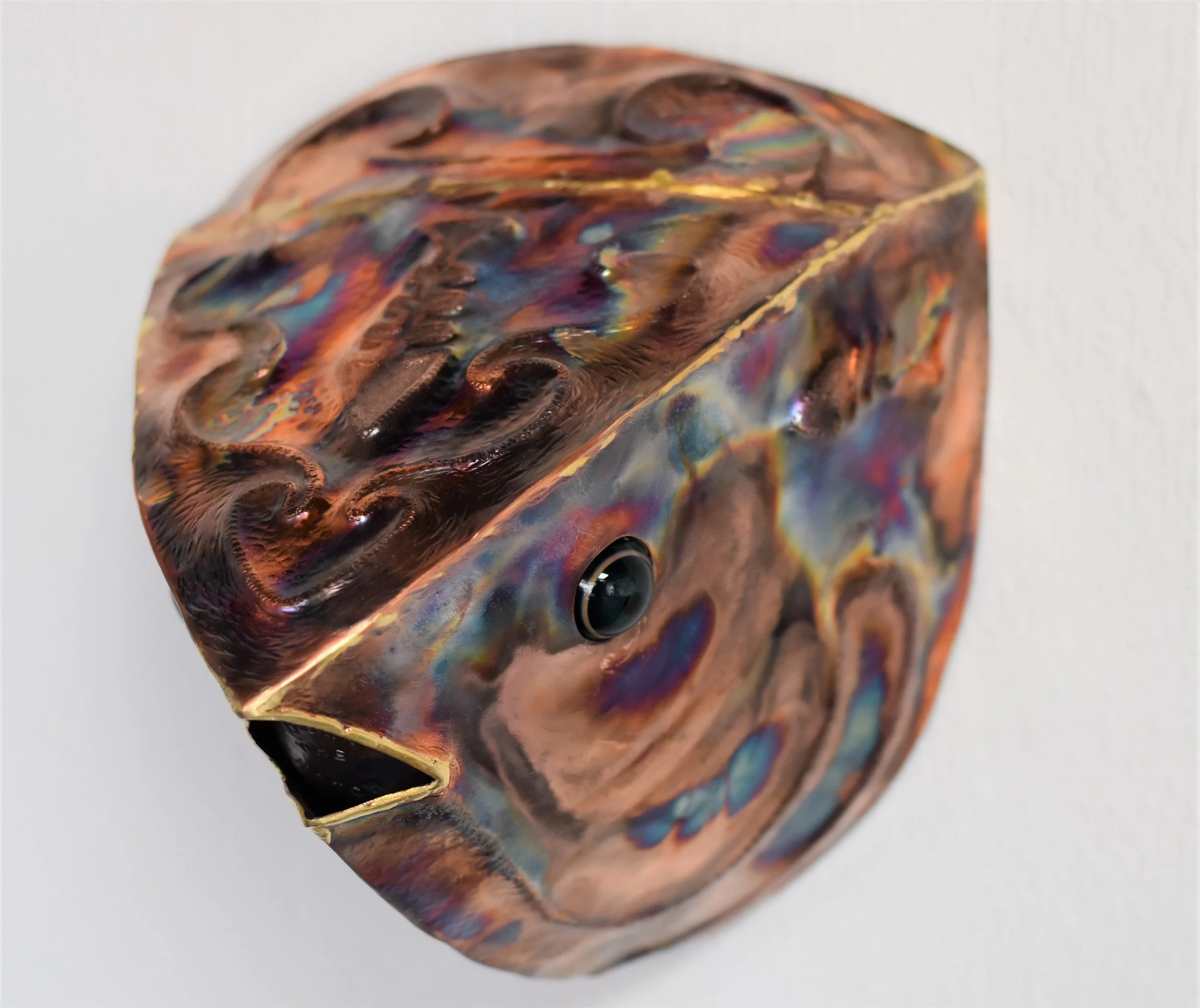 Copper fish head, glass eyes by Copious Glass