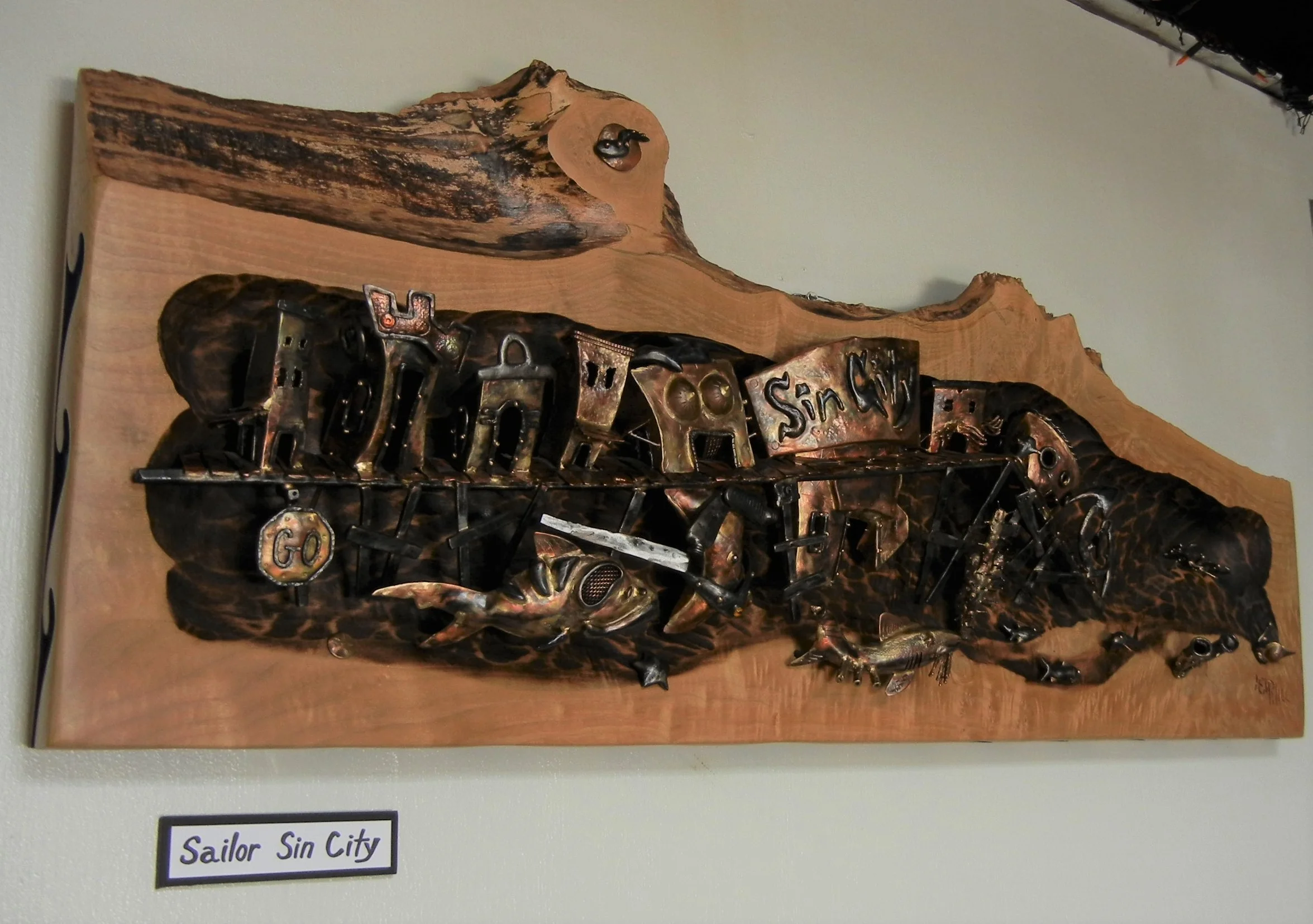  This sculpture was from three sketches all into one. What you see is what the sketch looked like. Myrtle wood, copper, steel &amp;  brass. 