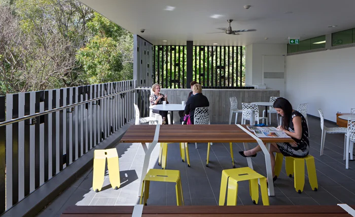 Staff can still find places to get away from students and reinforce their own community. This outdoor flexible space has fabulous views into the heavily treed campus.