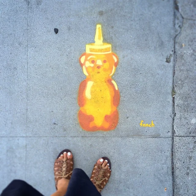 Street Artist Fnnch, seen around the corner from Blue Bottle Coffee in the Art's District