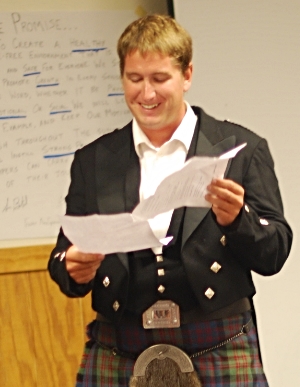 Mish addressing a TAC Burns Ceilidh