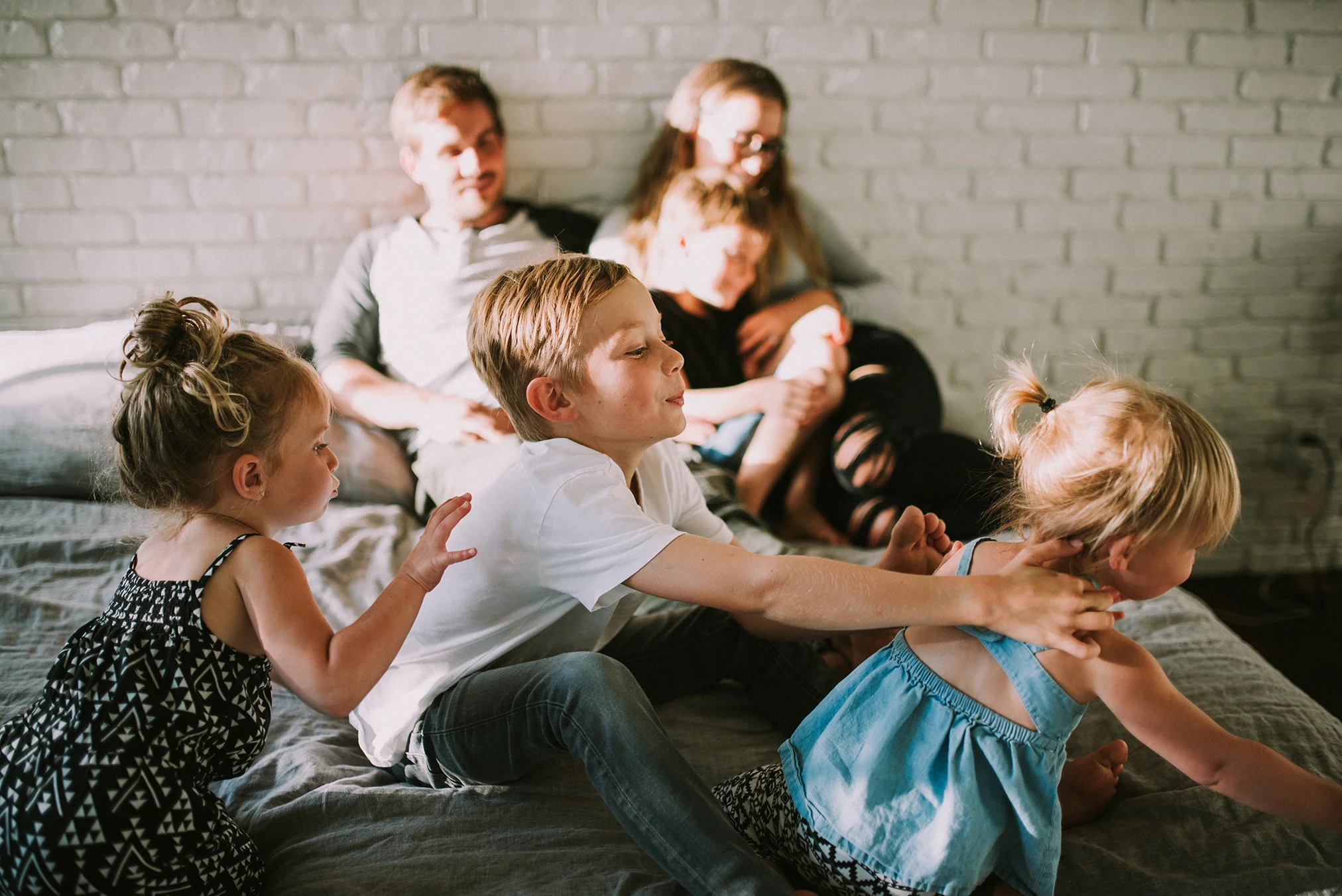 This family’s home was filled with so much light. Not just the physical kind, dancing through the windows like a summer dream, but the kind that can be felt within. The kind of light that sounds like laughter, and joy. The kind of light that feels like a hug wrapping around you. The kind of light that is gentle and enfolding, and seems to light you up from the inside out rather then the other way around. And simplicity danced around them, between what could have looked like chaos, but was actually a busy rest. 