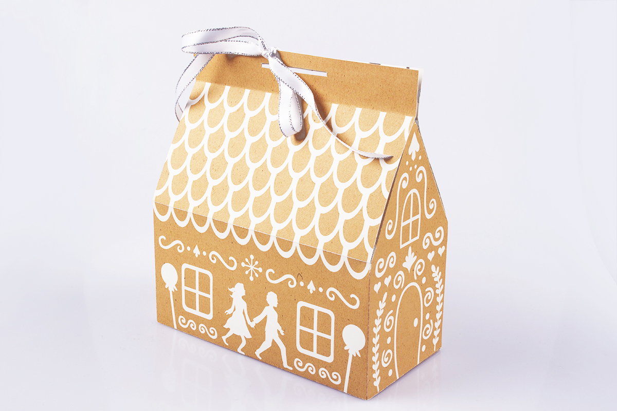 Gingerbread house inspired chocolate box. Figures of Hansel & Gretel feature at the front of the box. 