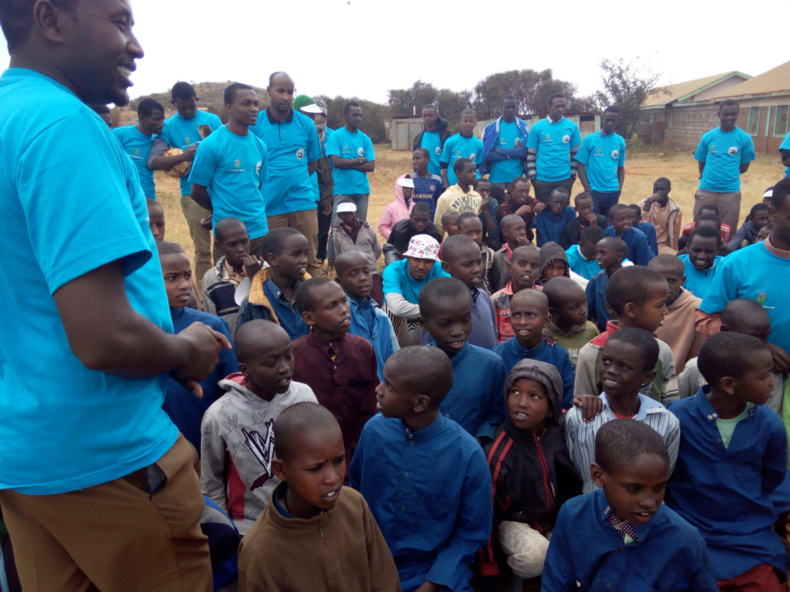 Hassan Mulata talking to children at Al Hidaya Orphanage during the #YouthDay