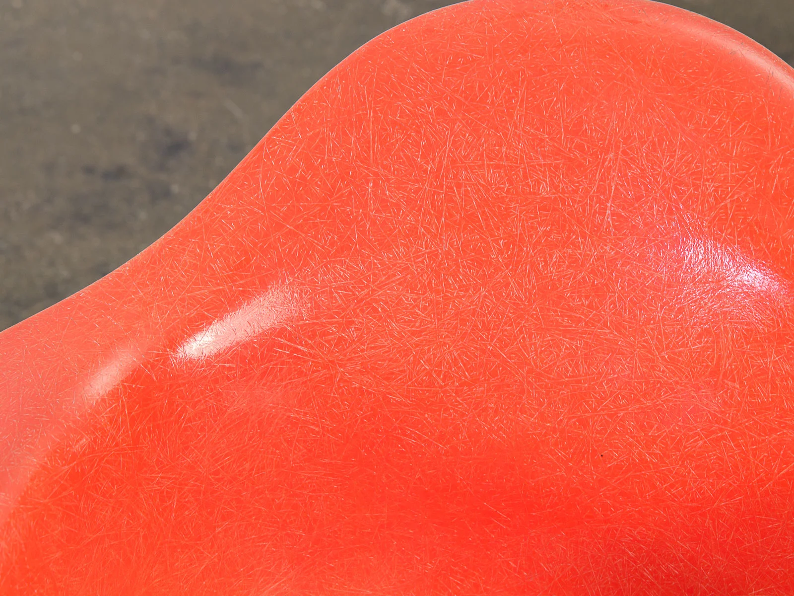 open_air_modern_pair_of_orange_eames_fiberglass_armchairs_for_herman_miller_on_black_eiffel_base-8.jpg