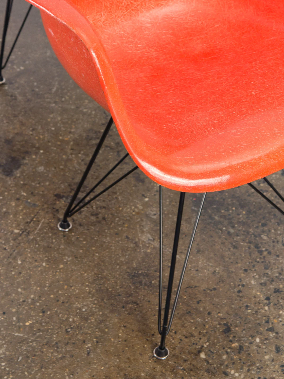 open_air_modern_pair_of_orange_eames_fiberglass_armchairs_for_herman_miller_on_black_eiffel_base-7.jpg