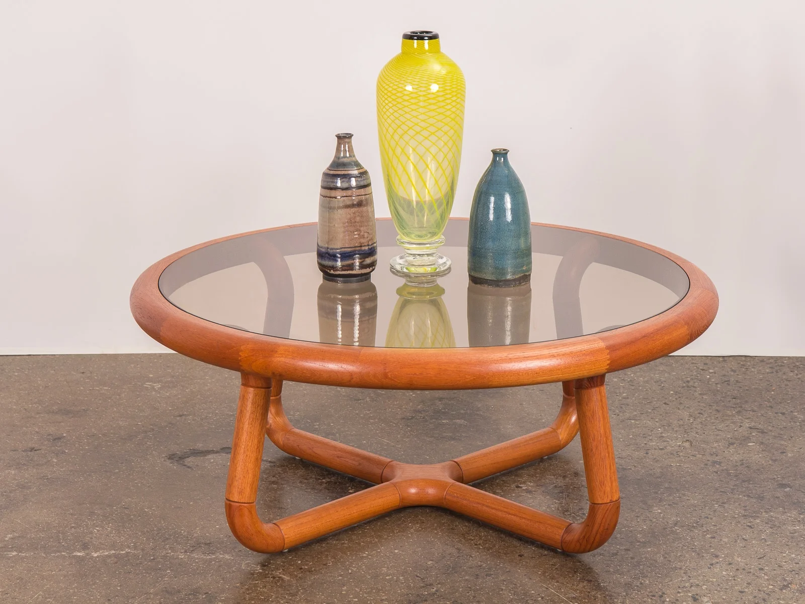 open_air_modern_scandinavian_danish_uldum_mobelfabrik_sculptural_curved_smoky_glass_coffee_table-4.jpg
