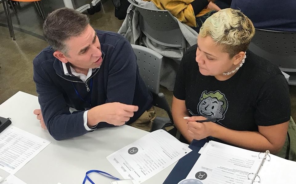 President Jim Wehner talks through a business plan draft with his Start:ME mentee.