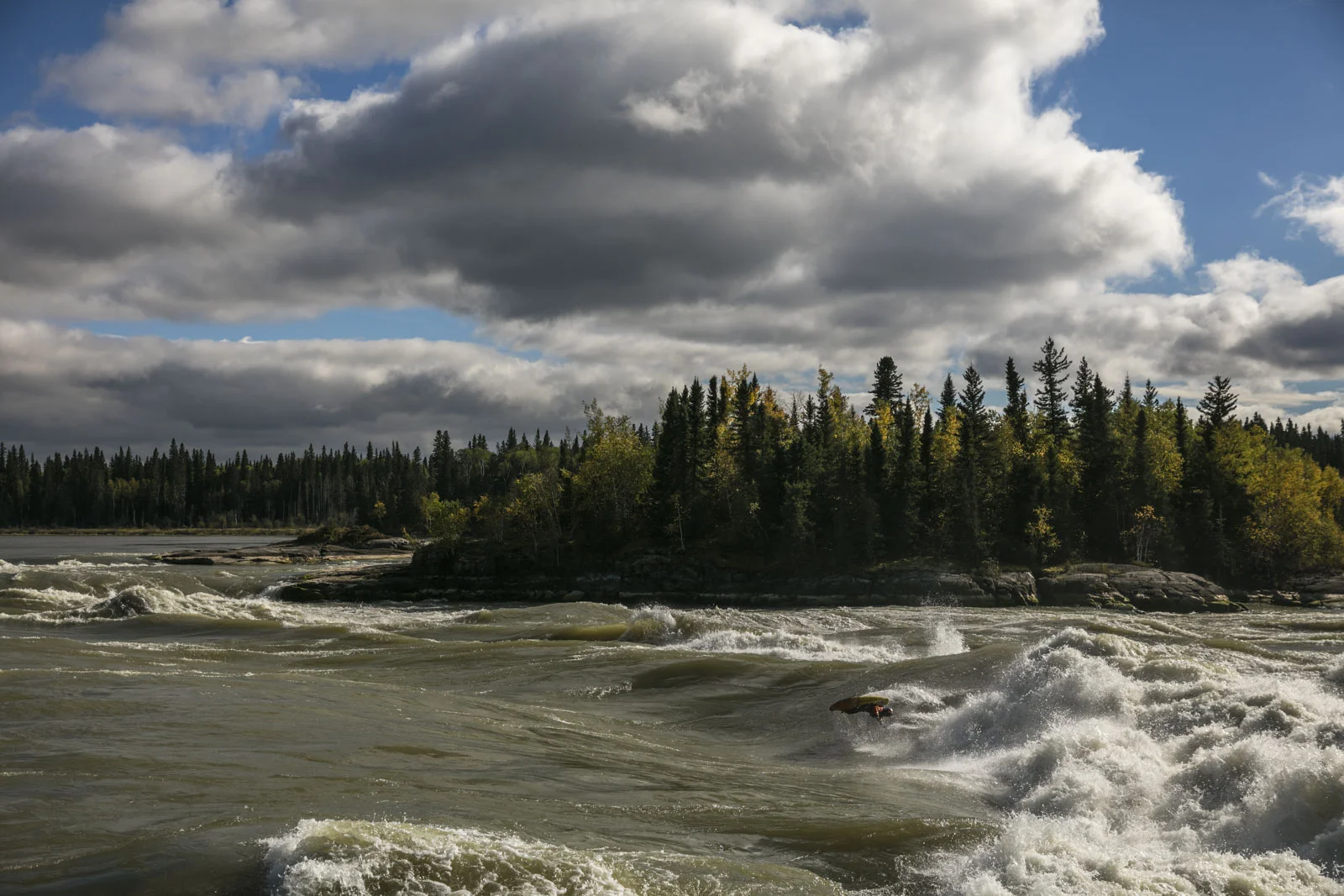 Ben Marr surfs Dream Wave at bladder falls during sunrise on the Nelson River , Manitoba.,Thursday September 15, 2016. Photo/David Jackson