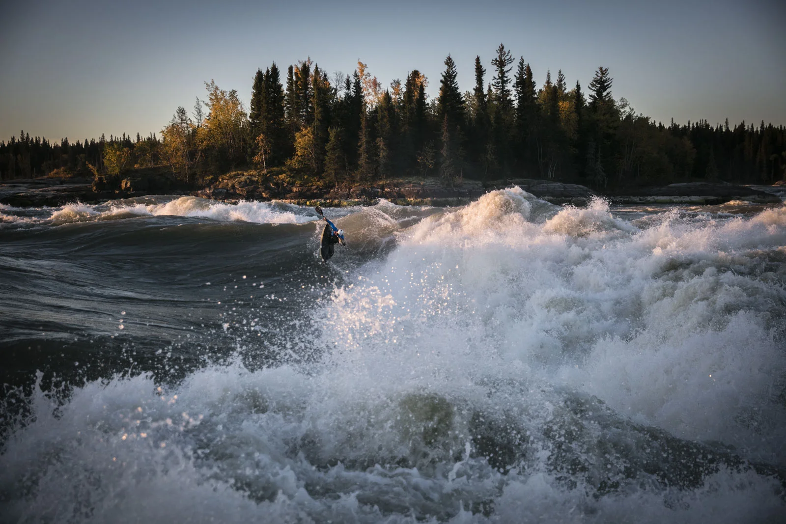 Ben Marr surfs Dream Wave at bladder falls during sunrise on the Nelson River , Manitoba.,Friday September 16, 2016. Photo/David Jackson