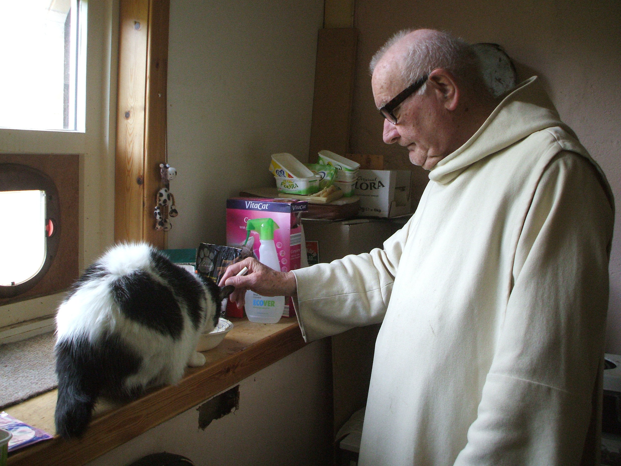 Br Meinrad mixing gravy for Baxter.JPG