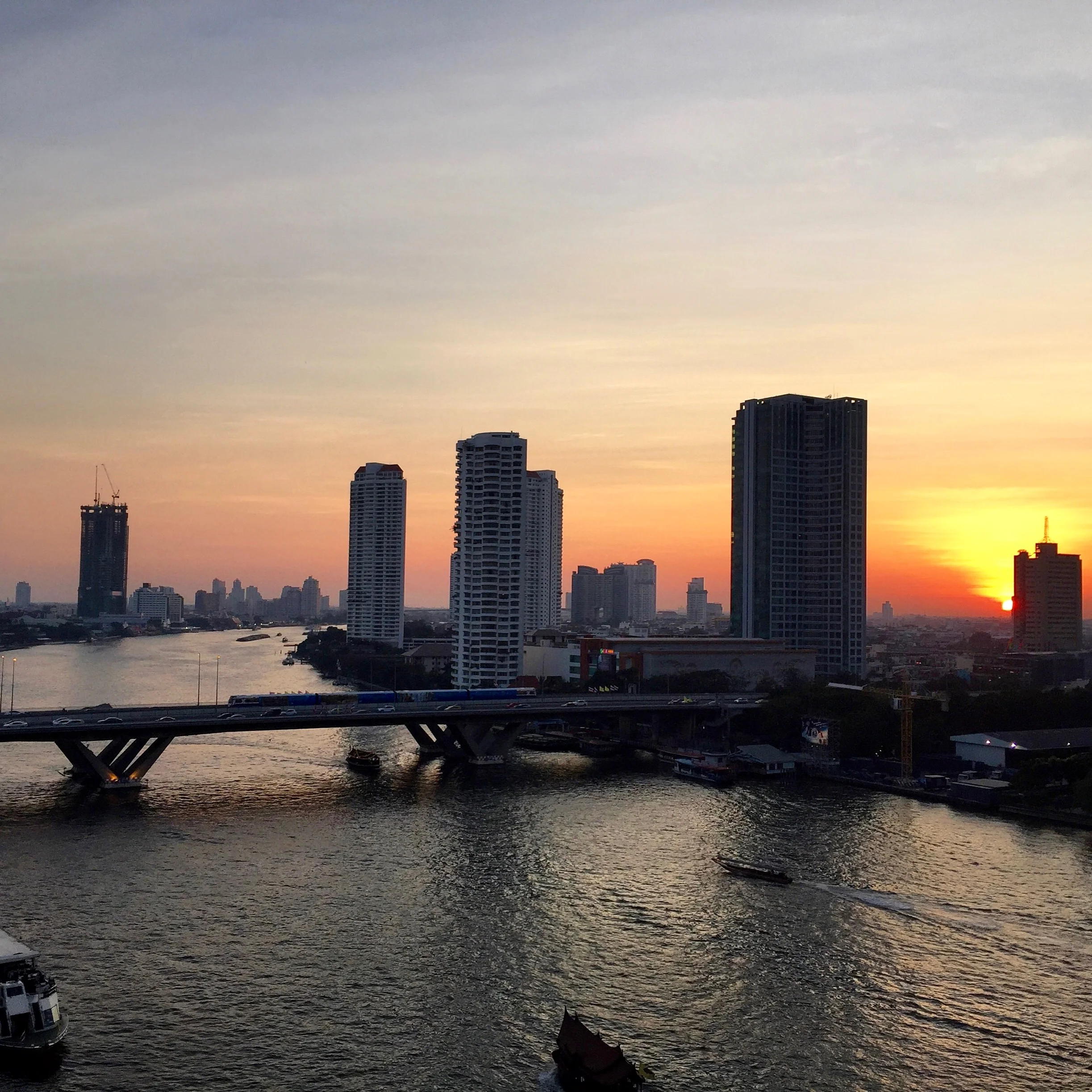 Sunset on the Chao Phraya river as seen from my hotel balcony. Sometimes the quiet nights in Bangkok are the best ones.