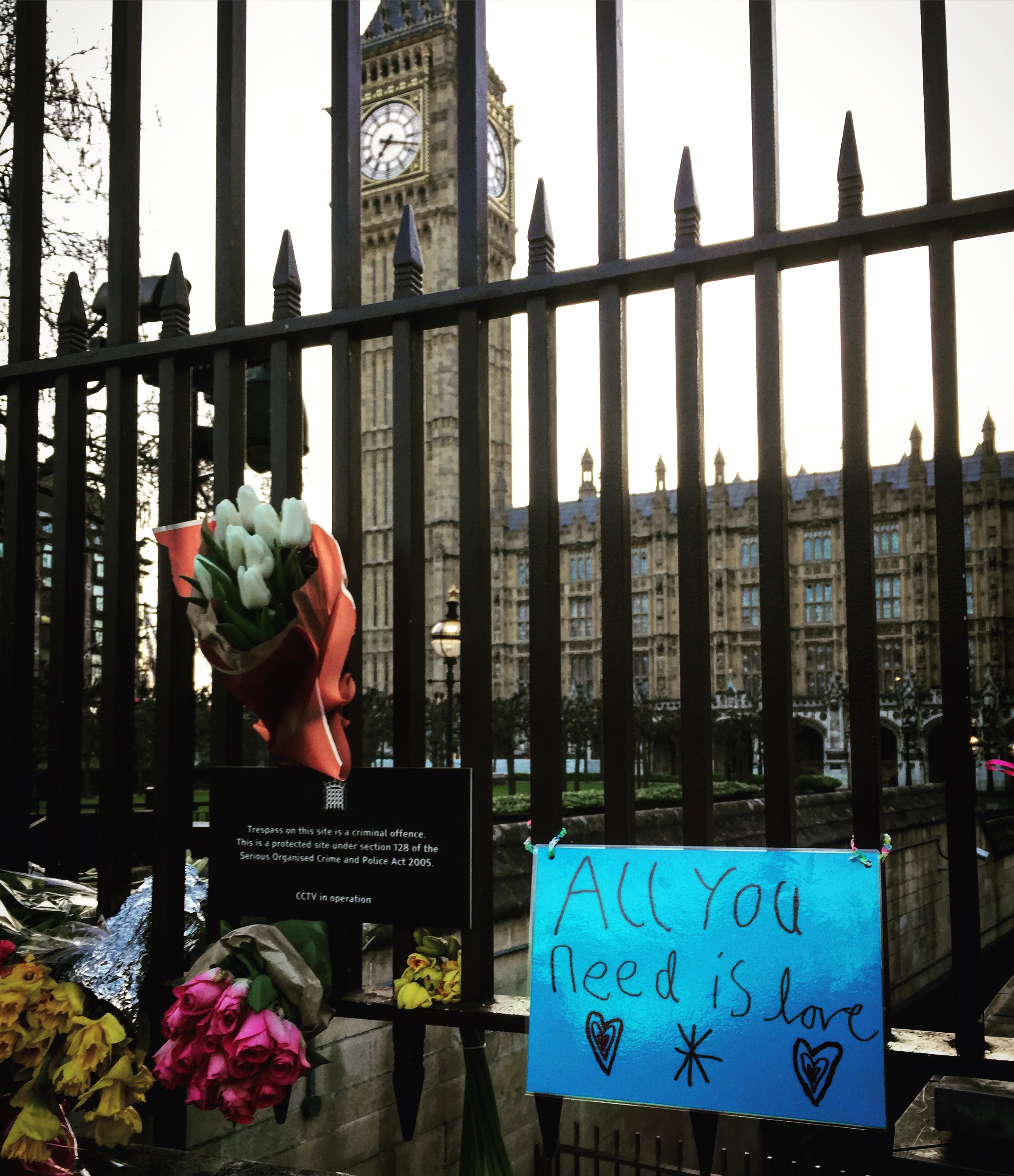 A few of the flowers and messages left outside the gates of Parliament after the March 22 attack. 