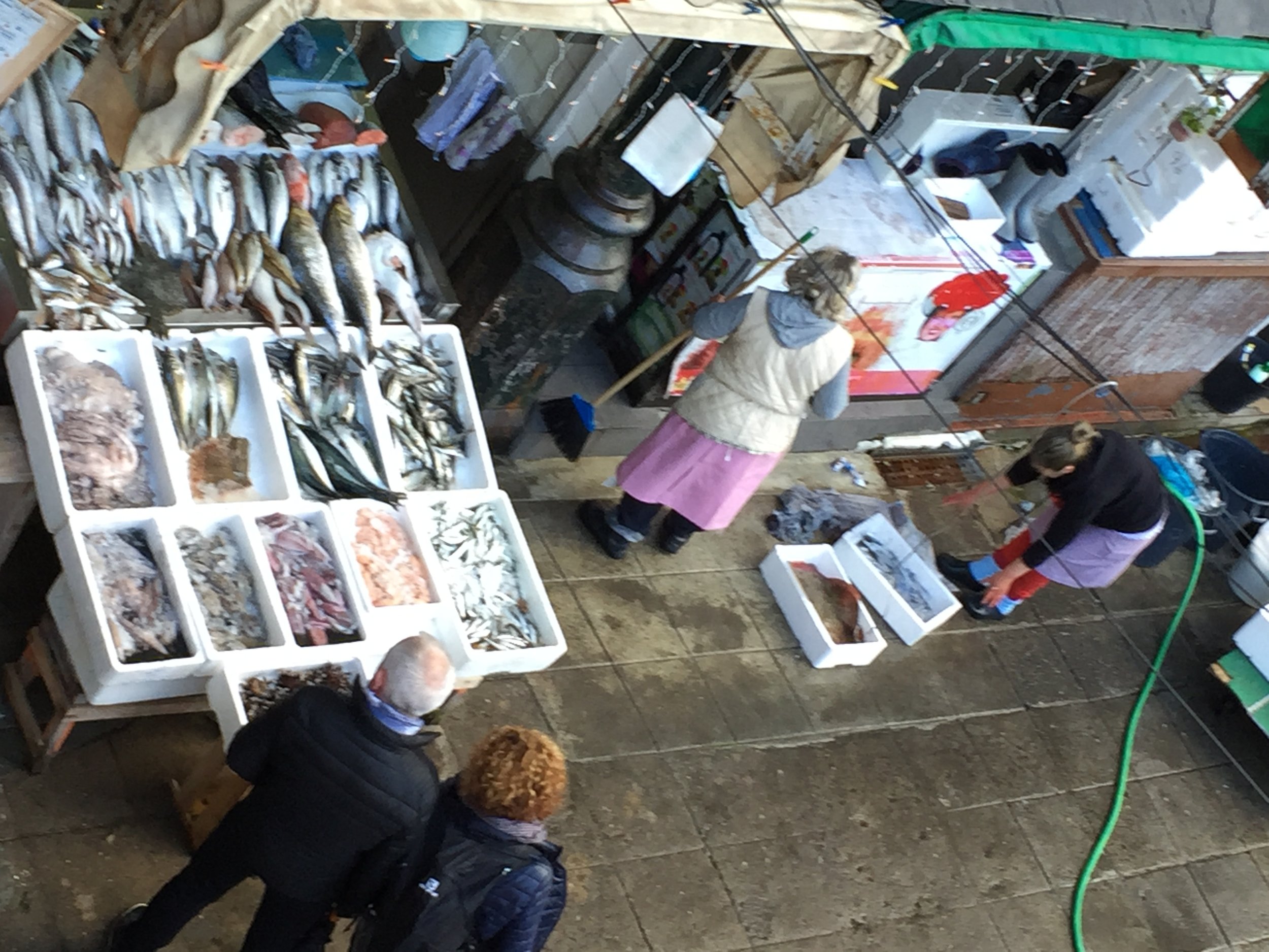 A view of a fish seller at the Mercado Bolhao. The market has been around for ages, but recently has fallen on bad economic times. The city is coming in to renovate the building and many of the shopkeepers will be moving to a shopping mall during construction. In a few years, a new market will be opening. I have a special love for old school markets, and am a bit sad to hear they will be going away. But for health purposes, I suppose it is for the best. And as a random aside, this particular fish seller was featured in Anthony Bourdain's, "Parts Unknown" episode of Portugal, and he will be revisiting her again this season.