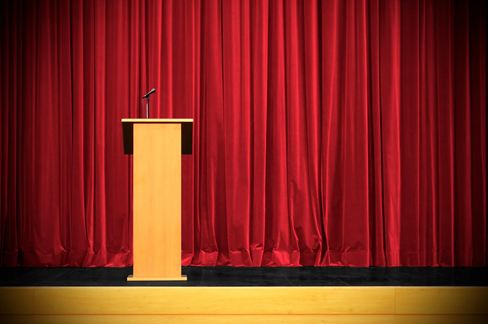 podium-in-front-of-red-curtain.jpg