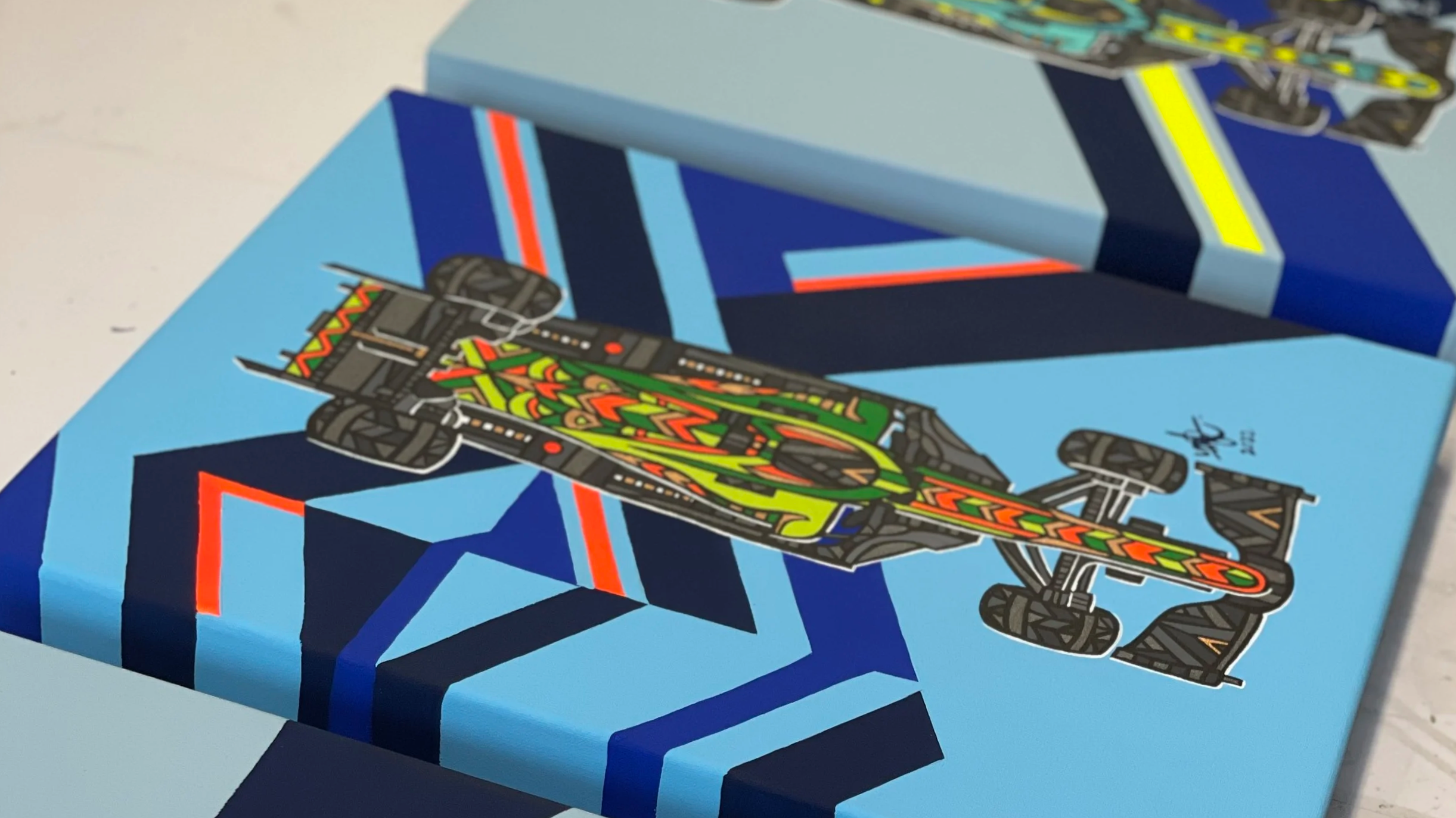 Colorful skateboard illustration with geometric background in shades of blue, red, and yellow.