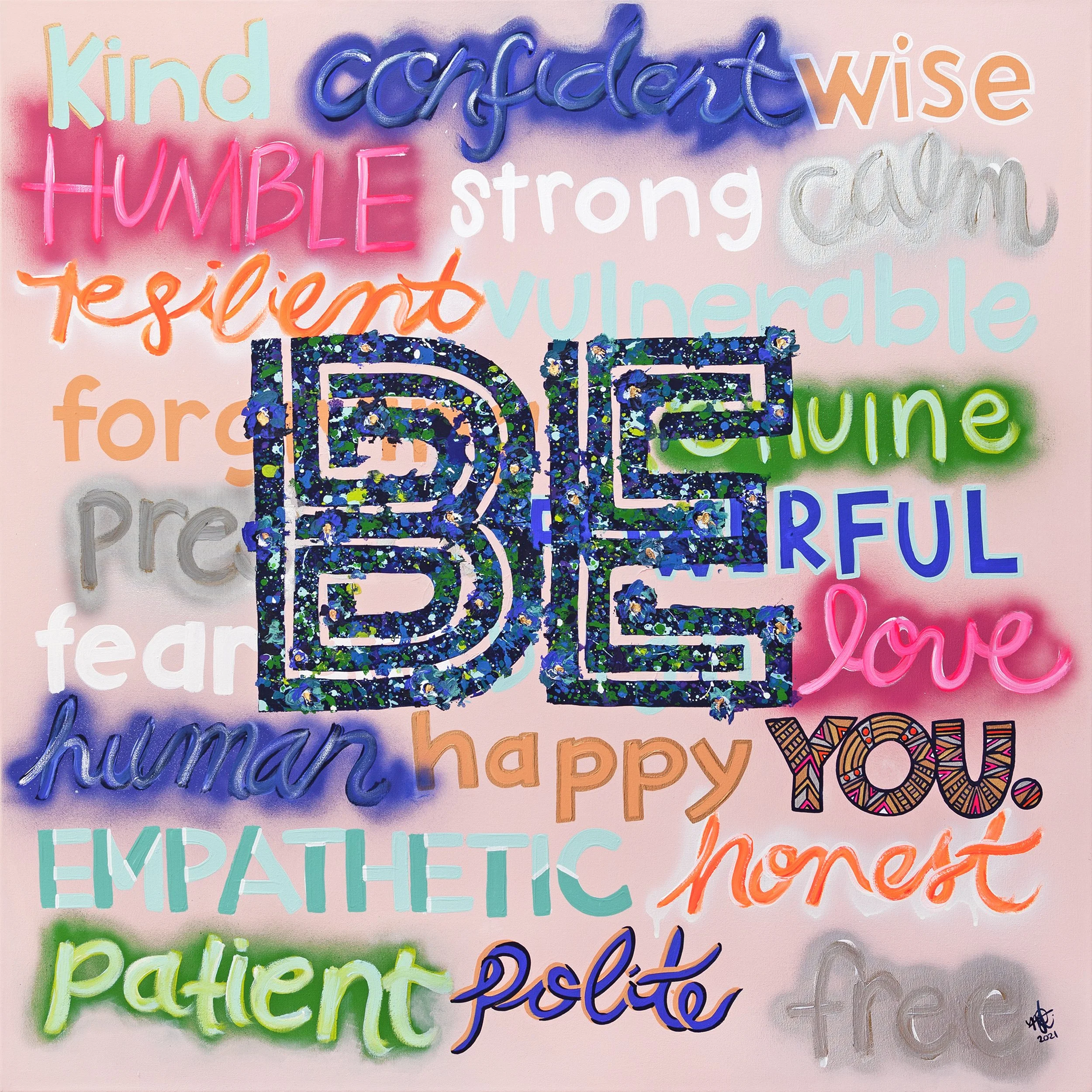 Colorful words related to kindness, empathy, and love arranged around a large, glittery 'Be' in the center. Words include 'kind,' 'wise,' 'respect,' 'humble,' 'strong,' 'caring,' 'vulnerable,' 'hope,' 'happy,' 'patient,' 'free,' and 'love.'