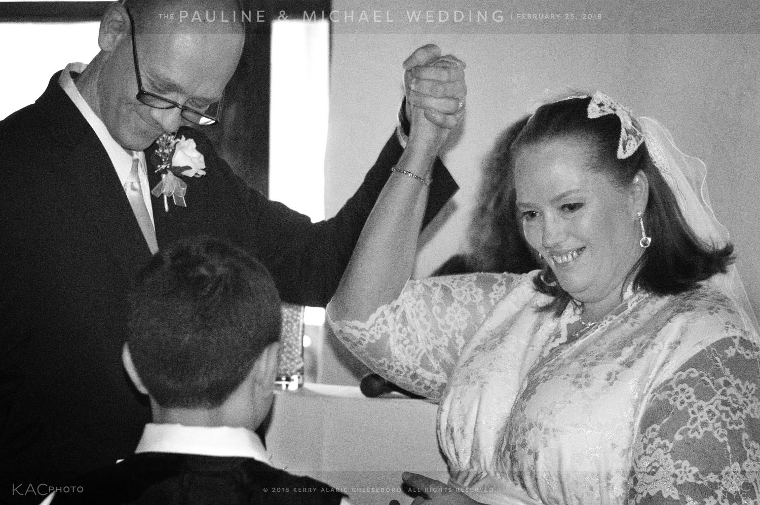 kac_photo-180225-events-pauline-michael-wedding-handsclenched-in-air-1-bw-1500.jpg