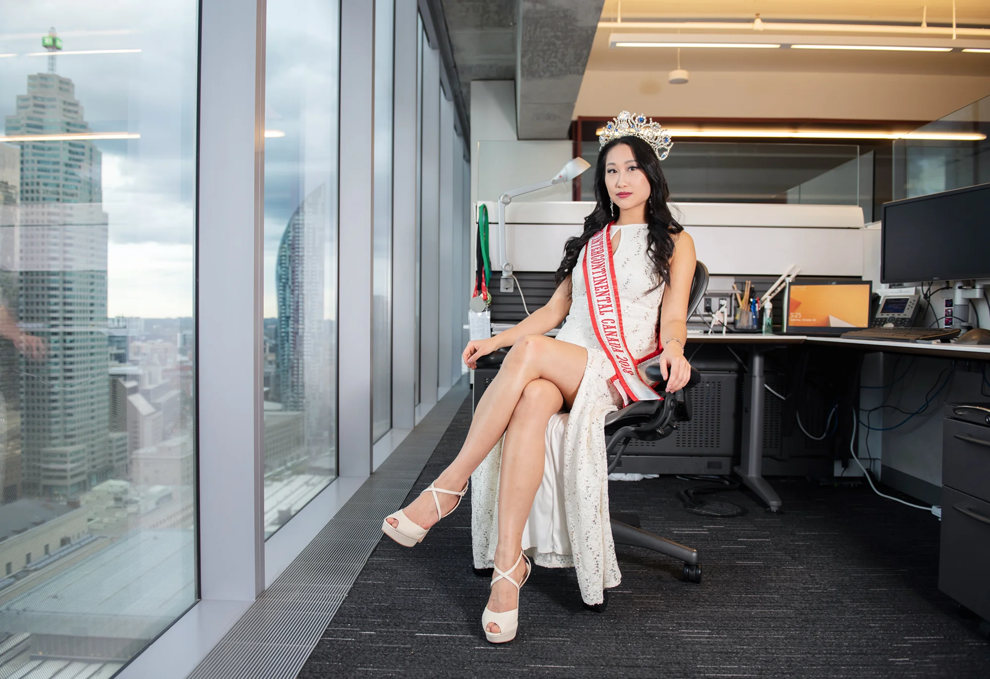 Alice Li, reigning Miss Intercontinental Canada 2018, at her office. She works full-time as an accountant while also doing pageants, and busking at TTC stations and other public places around Toronto for charity.