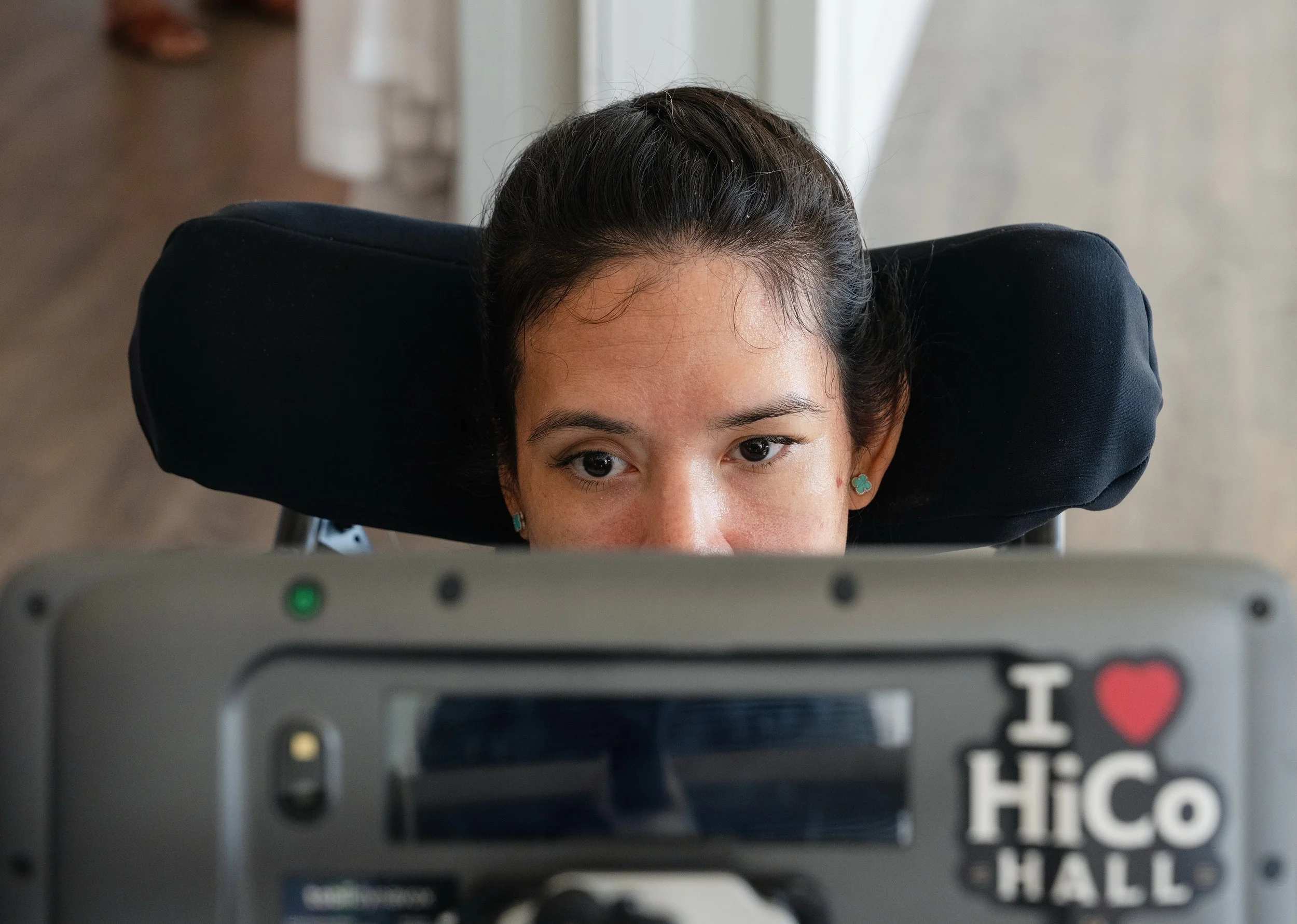 Desiree Galvez Kessler, who has lost her ability to speak, communicates with her speech generating device controlled via eye tracking.