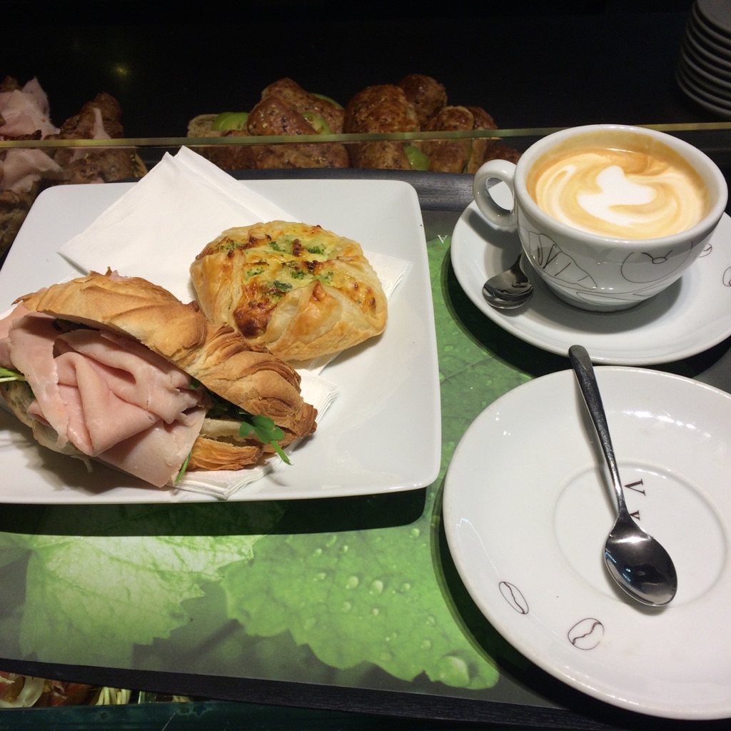 I got the broccoli, egg and cheese puff pastry and cappuccino and Isaac had the sammie. 