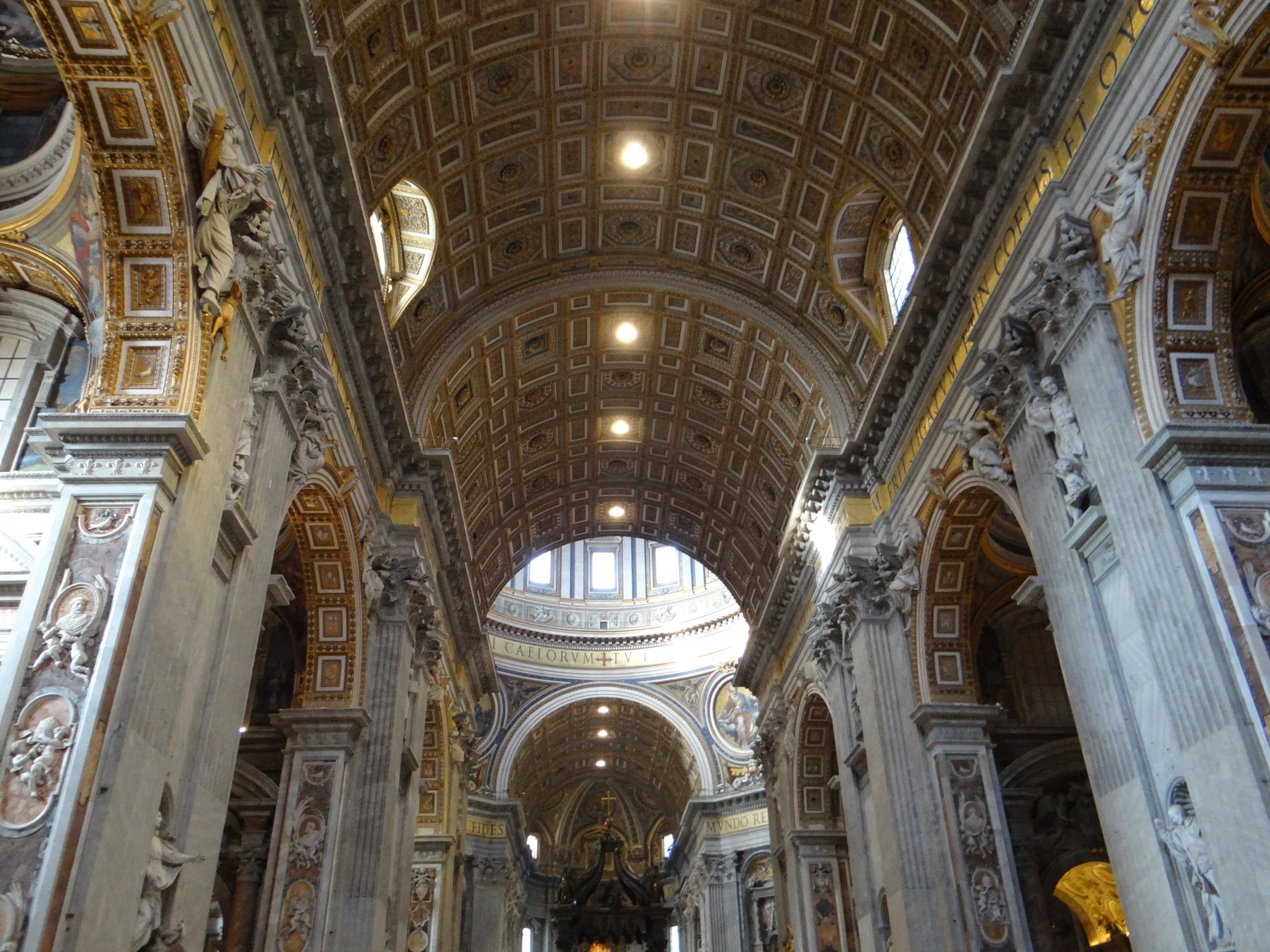 Inside St. Peter's Basilica. Did you know they have embalmed popes in glass boxes that you can see? Creepy...