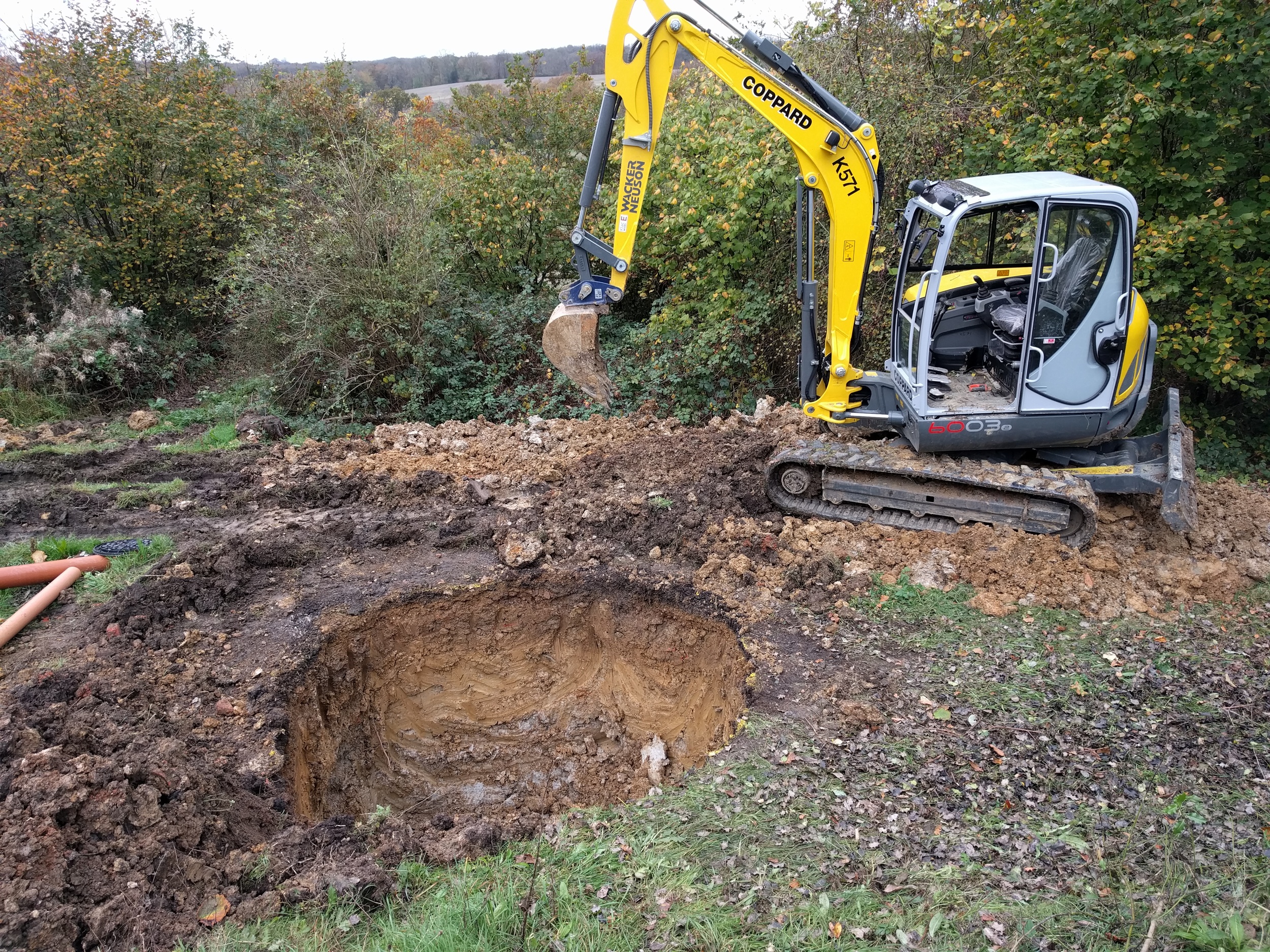 Meanwhile, in the outside filth, eight cubic meters of clay makes way for a biodigester, which will munch through the liquid waste which can't be used as cattle feed.