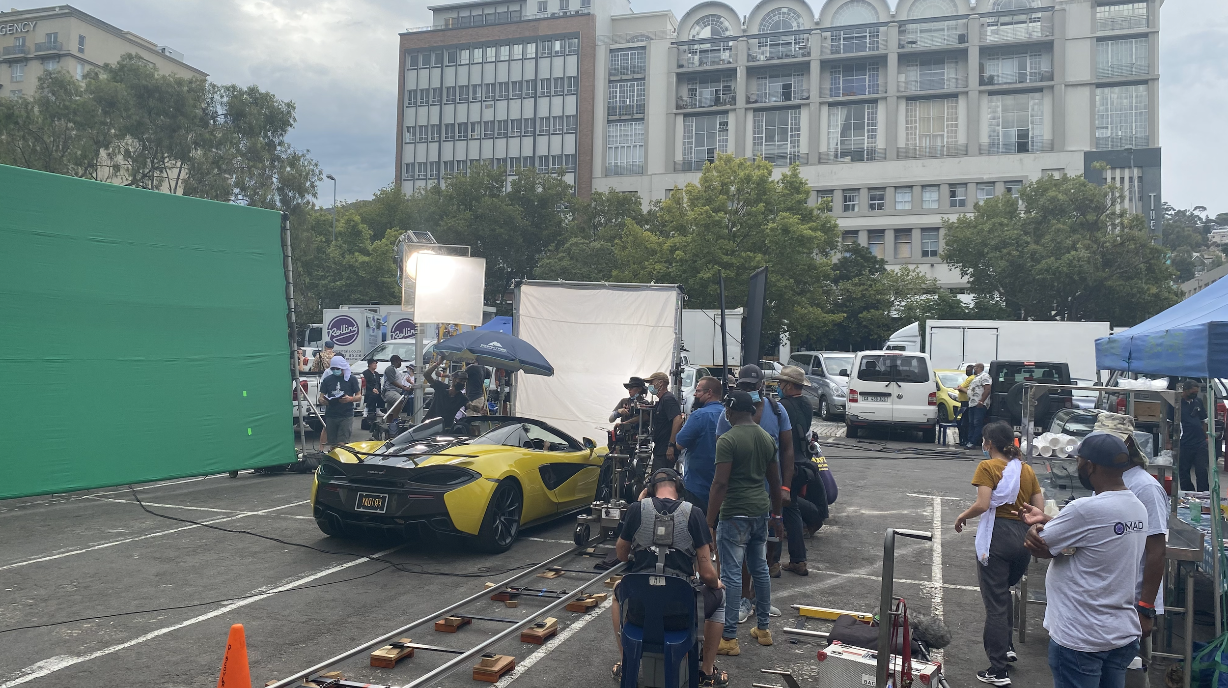 Fry Again filming beside the yellow car