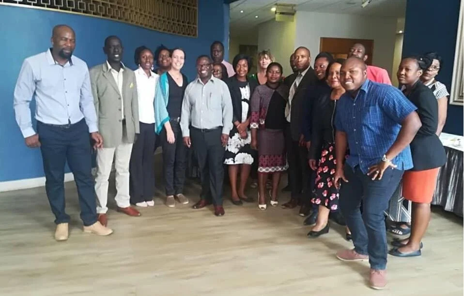 Zimbabwe Commission members led by Co-Chair Dr. Mudavanhu (far left) convene on Day 2 of their priority setting meeting.