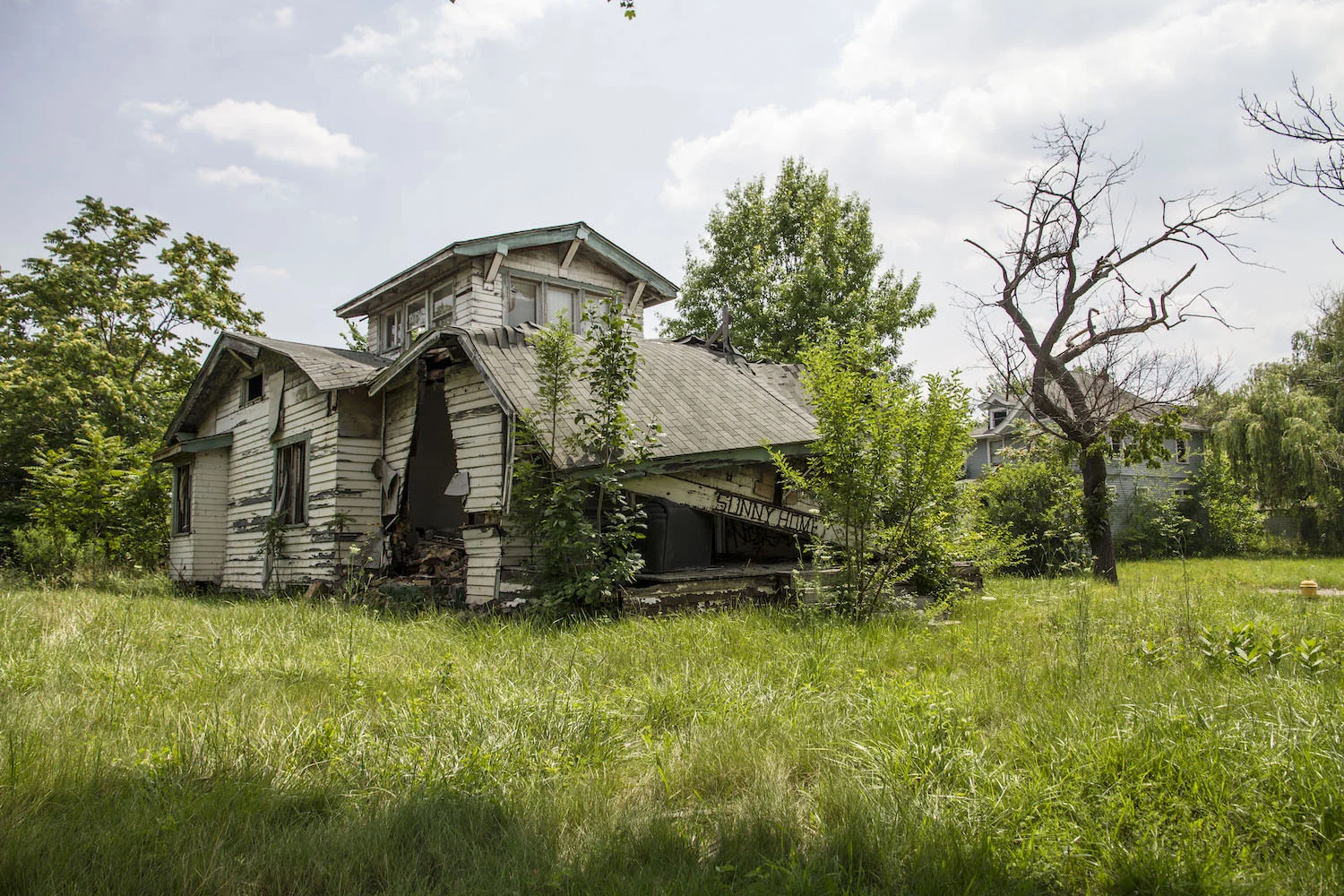 This decrepit home was on a residential street, next to other homes where people still live. There are some 70,000 abandoned homes in Detroit.