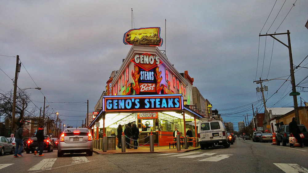   Geno's Steaks , a Philly cheesesteak original.&nbsp; Pat's King of Steaks &nbsp;is across the street. Both are open 24/7 and are always packed. 