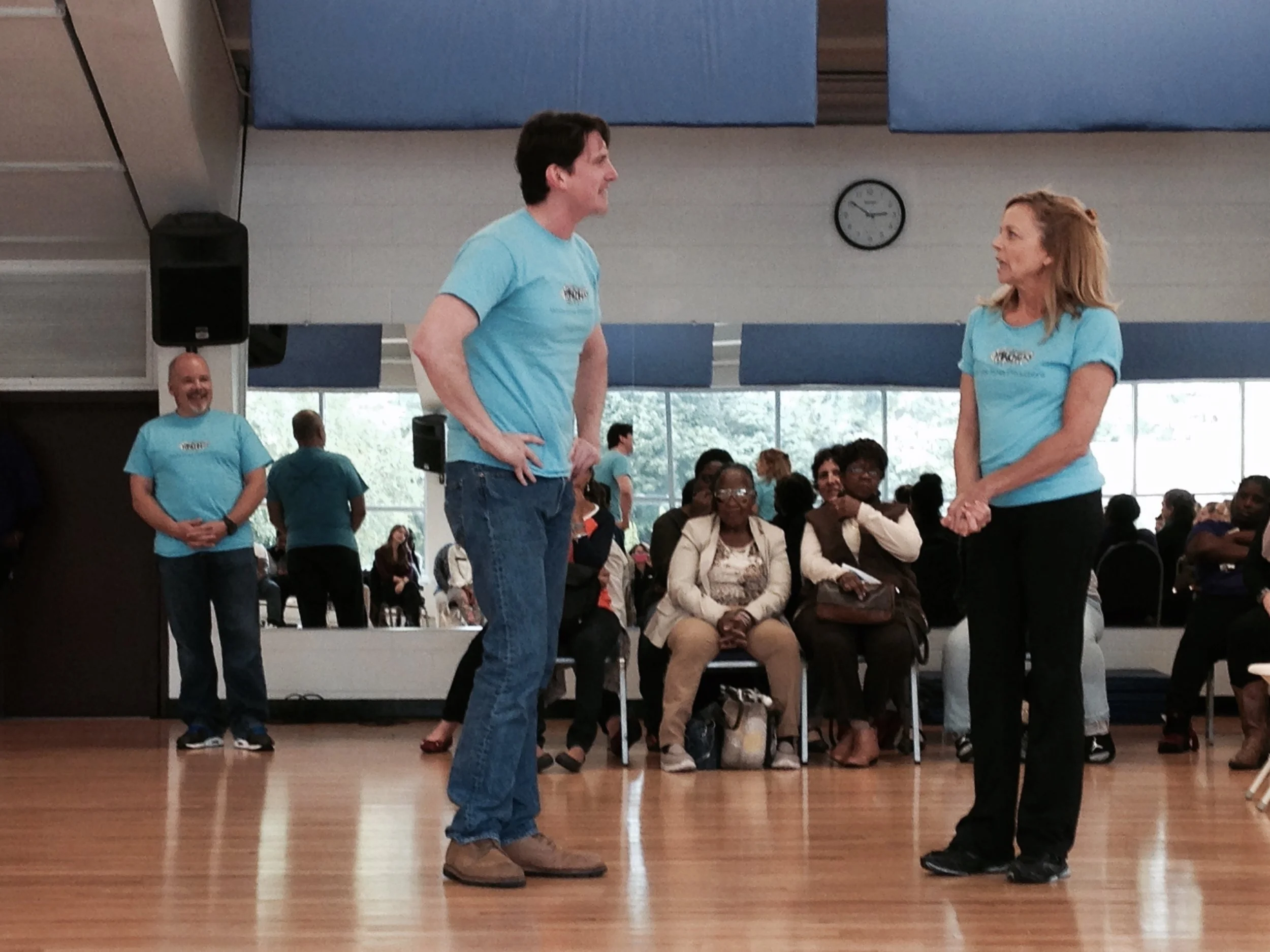 Bob Stineman and Michelle Pauls perform a scenario for the YMCA under Benjamin Lloyd's direction. 