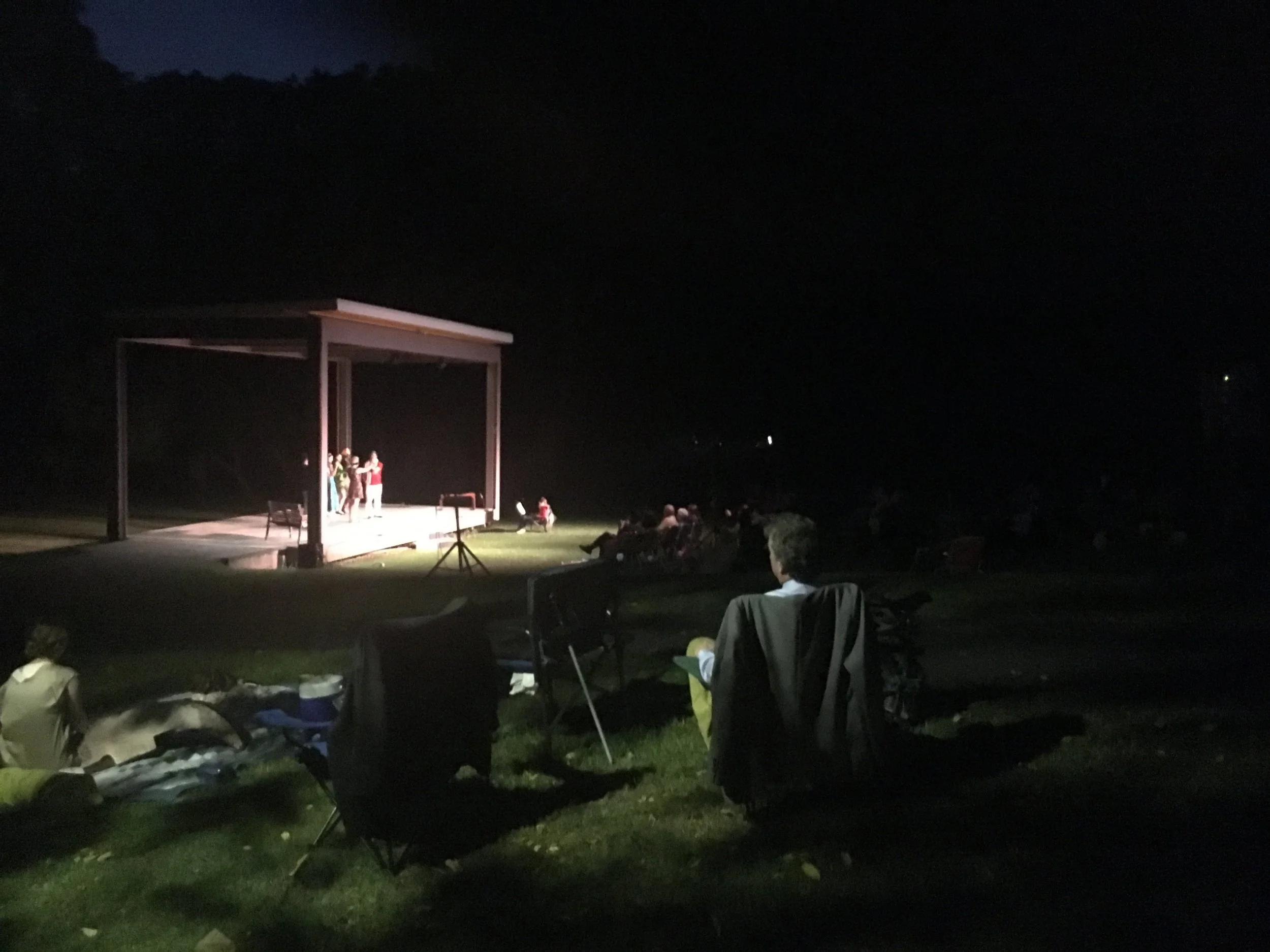 The audience enjoys the show as the day turns into night! 