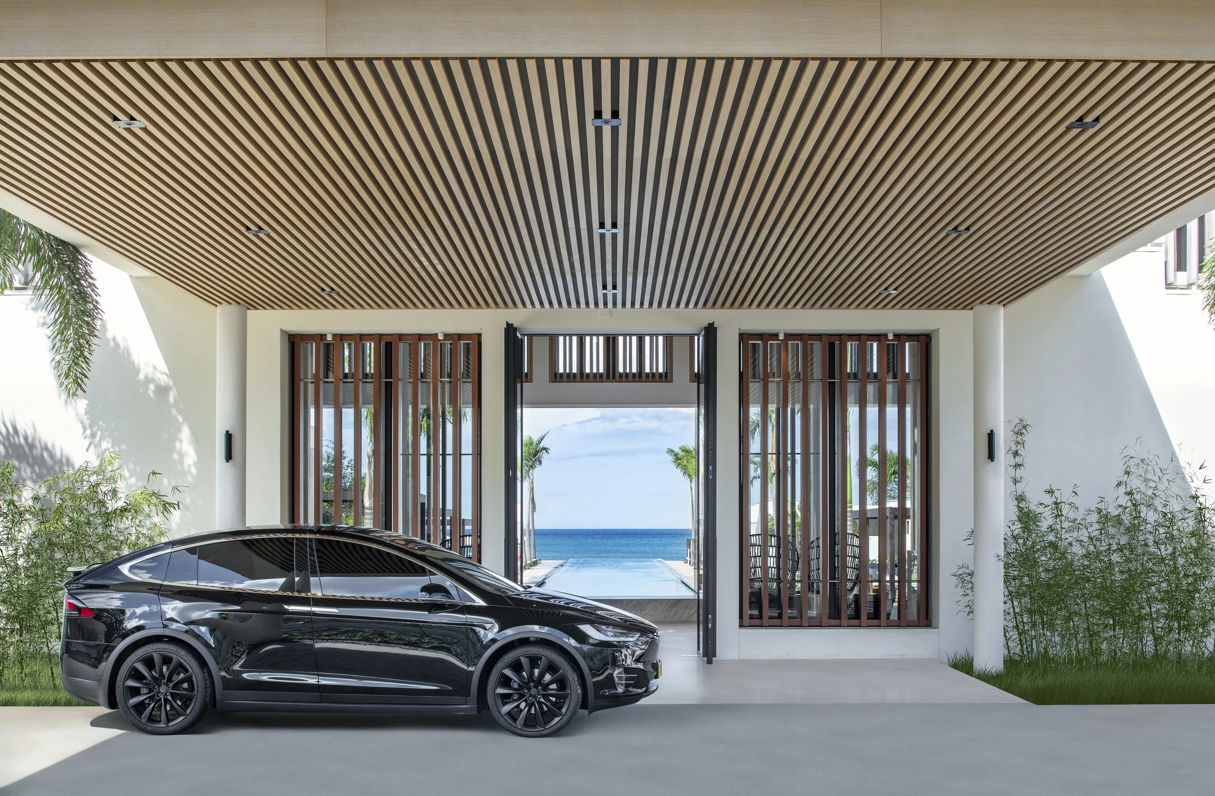 Entrance to hotel with Tesla.jpg