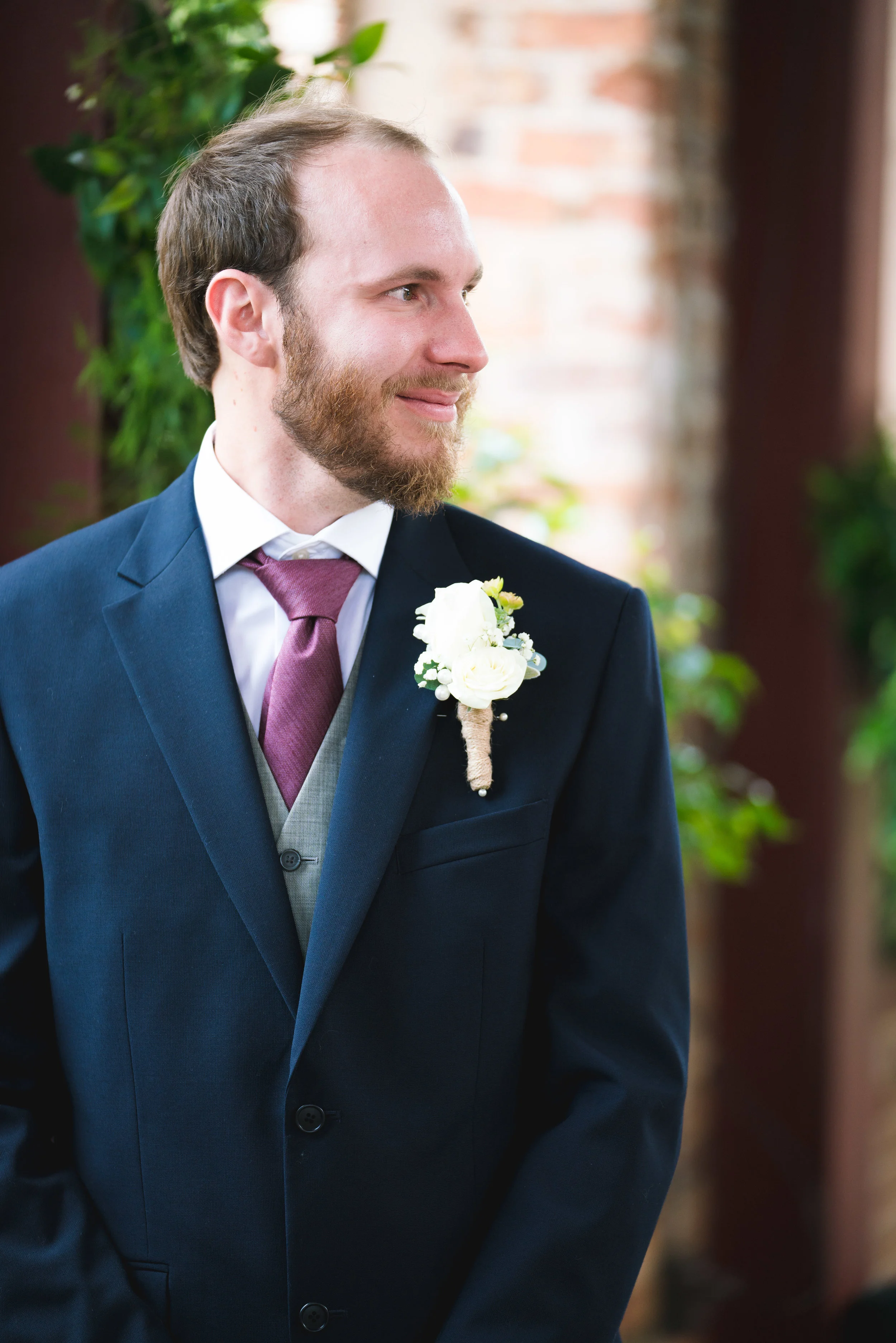 Groom watching bride, Larkins on the River Downtown Greenville Wedding