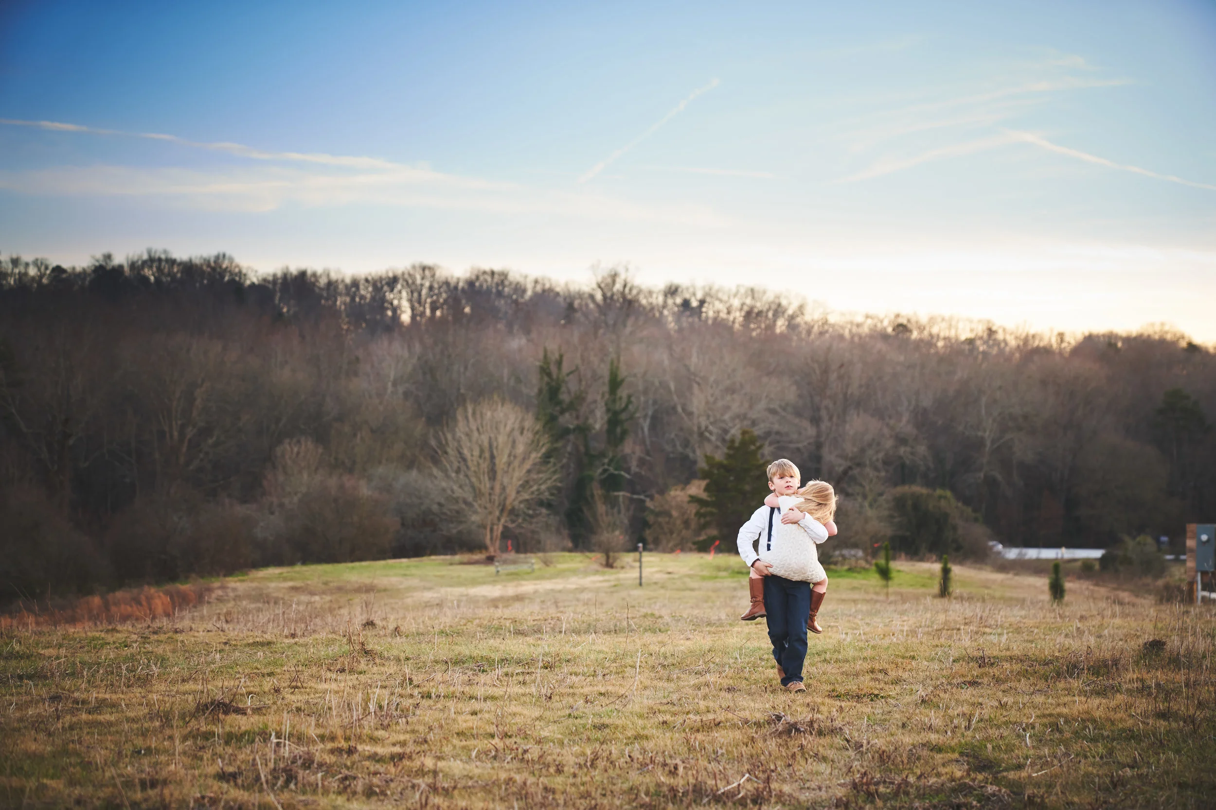 Family photo session in Clemson Botanical Gardens, Clemson SC | Brother carrying sister