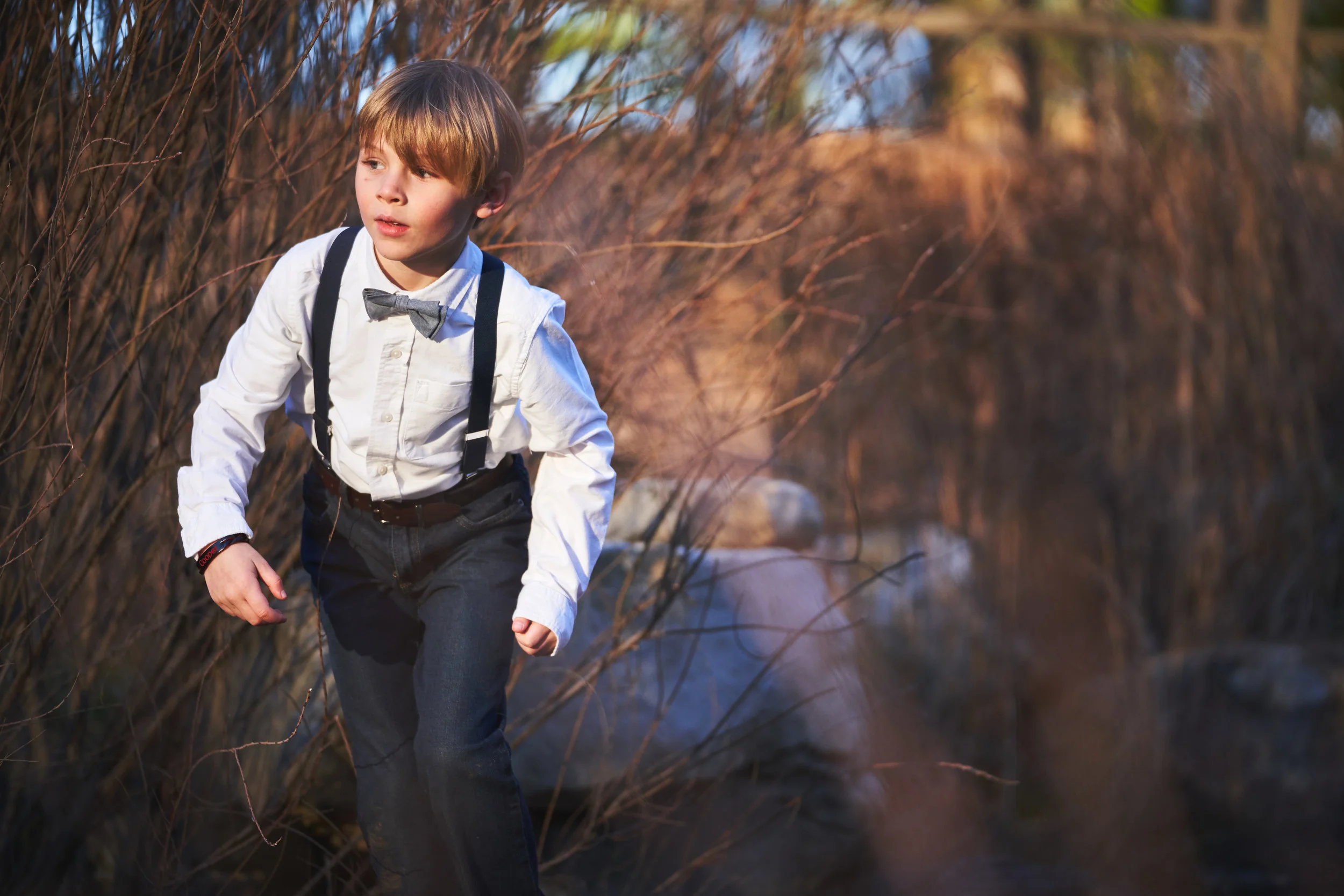 Boy walking into the sun | Family Photo Session at the Clemson Botanical Gardens