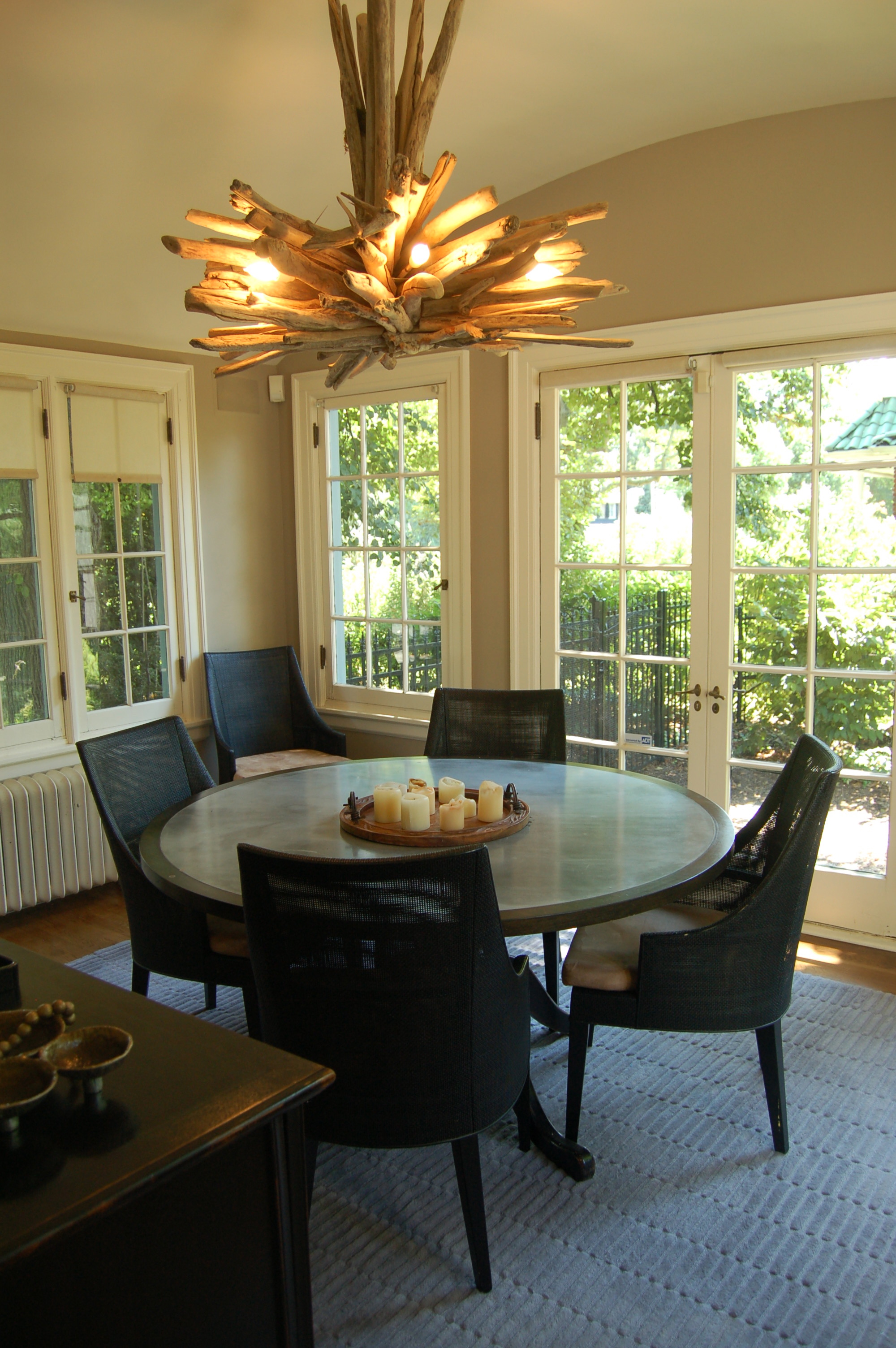 A gem of a house that was built as a wedding present. Owners decided to move their dining room into the side porch and use the dining room as a den adjacent to the kitchen for modern living. I presented neutral Farrow and Ball tones to compliment the primary tones of the decor throughout the ground floor. The curved ceiling in the dining room was painted with a high gloss finish to contrast the rustic wooden fixture.