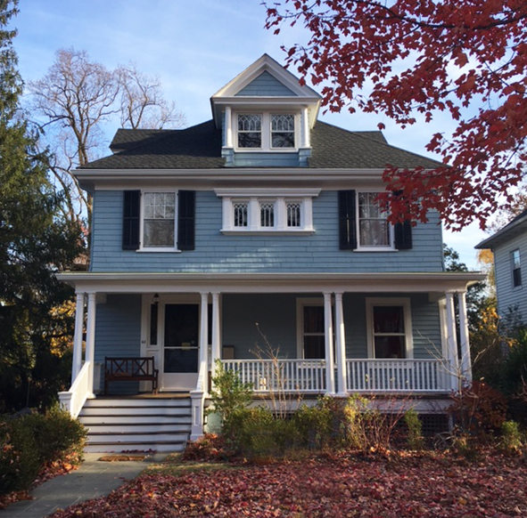 AFTER: The client chose Benjamin Moore Nimbus Gray accented with crisp white trim and accented with dark tones from Farrow and Ball. 
