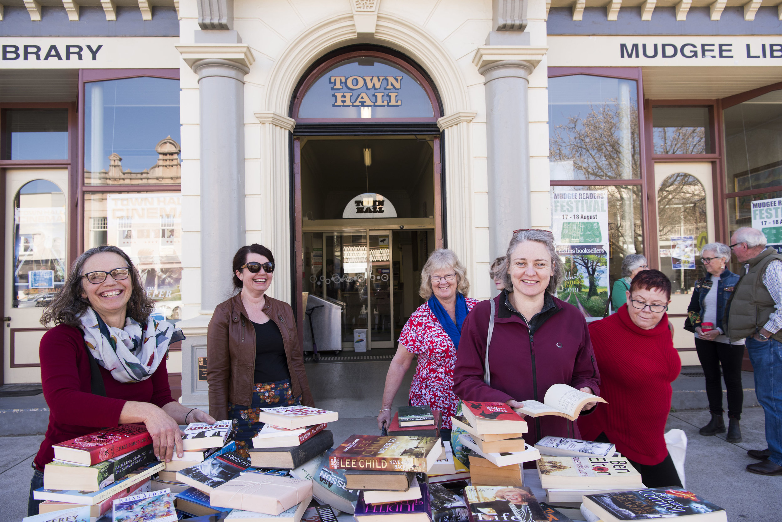 Happy readers at the MRF Book Swap Bench outside the Mudgee Library
