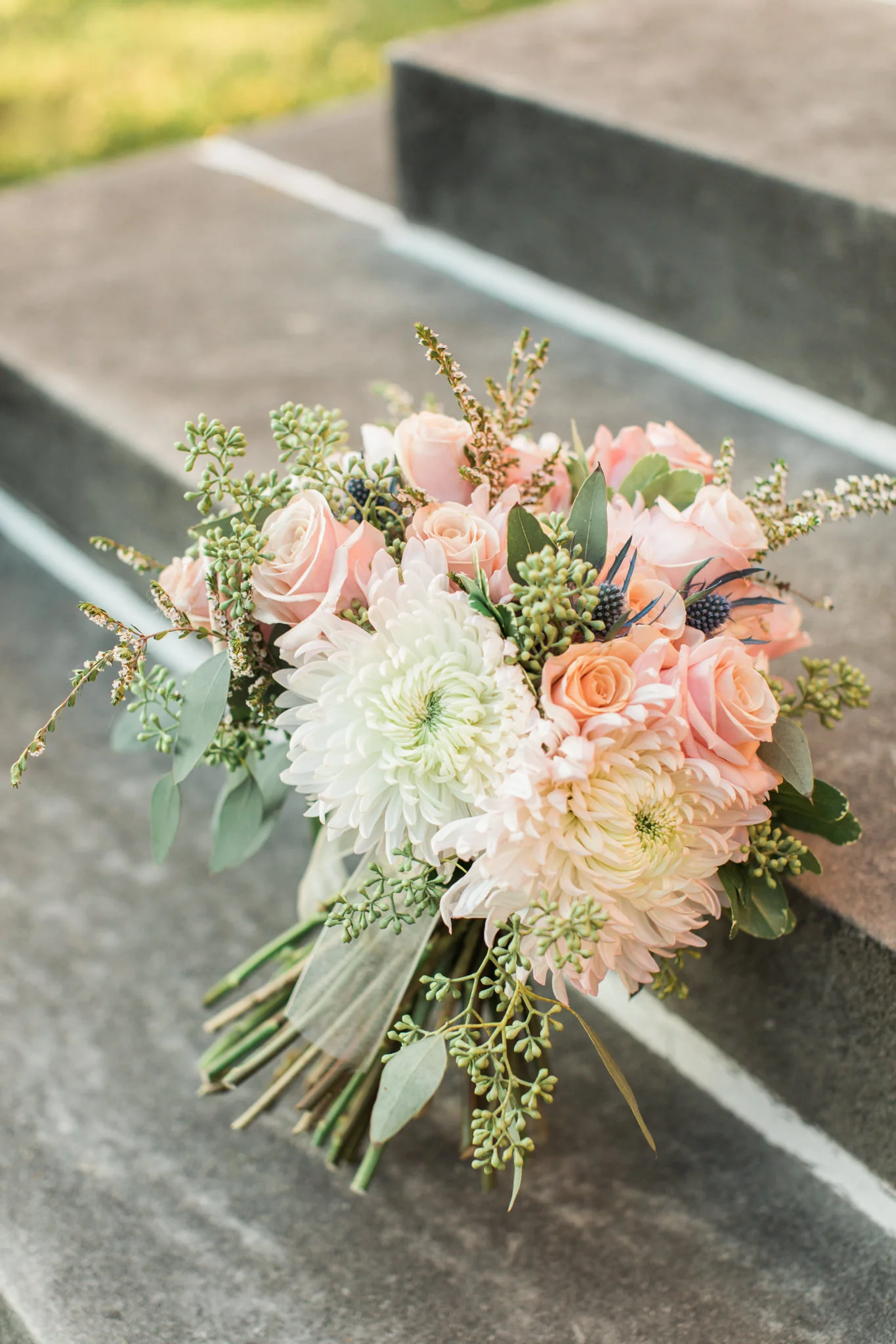 Bouquet outside on steps at Gardencourt Louisville Wedding Venue