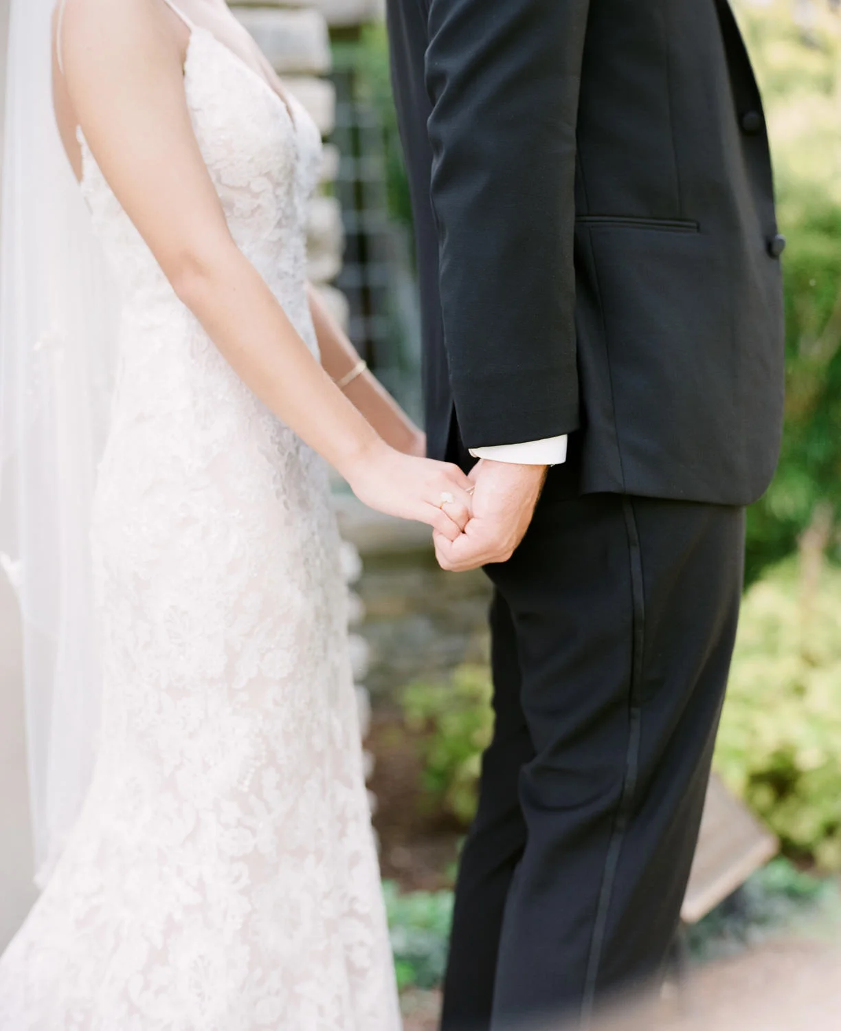 Image of bride and groom at Yew Dell holding hands during first look