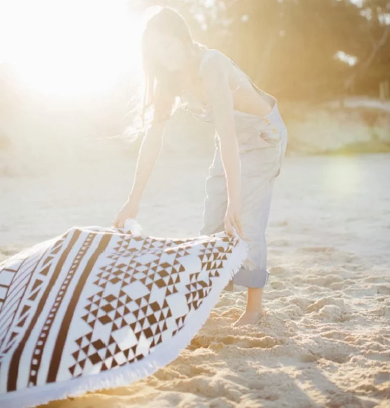 The original roundie - Aztec inspired black and white print with a white tassel.