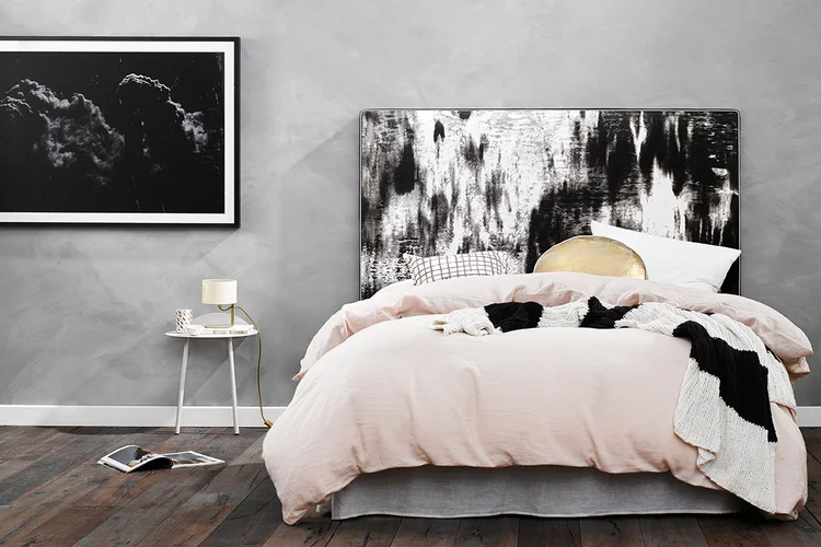 FIRST LIGHT - A rich contrast between the dark of the night and morning daybreak. First Light delicately merges black with white to create a smooth oceanic ripple. Framed with silver metallic piping, this piece is light and airy and is best teamed with soft pastel hues and hints of gold. 