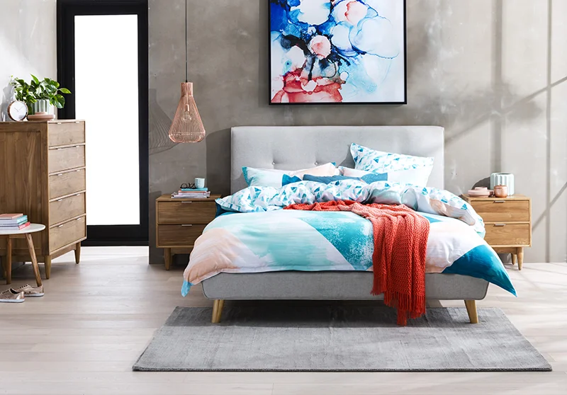 Bring a modern edge to your bedroom with the Tara. Clean contemporary lines are softened by the bed's curved base feature, angled solid pine feet and the beautiful upholstered treatment in Oatmeal with button detail. Tara Queen Bed: From RRP $699 - pictured with the Cino Bedside Table and Tallboy (see below for pricing)