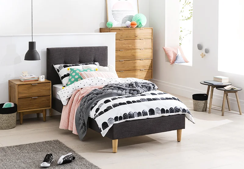 With a playful sense of maturity, solid pine feet and a fully upholstered classic design finished with a button detail makes the Jasper a stand-out option for any kids’ bedroom space. Jasper Single Bed: From RRP $499 - pictured with the Cino Bedside Table and Tallboy