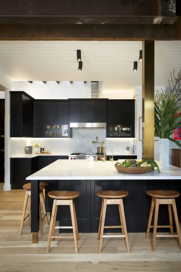 New-Age Shaker Black is the new white in kitchens – it’s the perfect way to put a modern spin on a traditional Shaker-style design. The Sierra cabinets in Matt Black, Caesarstone ® benchtops in Pure White and gold highlights gives a luxe look and contemporary feel without adding a high-end price tag. Designed for a Melbourne family of four, this kitchen needed to be as functional as it is beautiful. The supersized island bench offers plenty of seating, storage, a place for appliances as well as a secret hiding zone for the two young boys of the house with the centre of the island! A butler’s pantry and laundry adds additional storage and workspace to this busy kitchen.