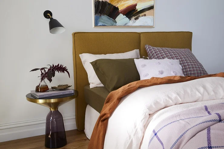 Armelle - offers a contemporary play on a low, casual bed head which has been finished in luxury Belgian linen in the colour du jour – mustard. Two deep cushioned panels are fixed together to create the bedhead, while small flange detail on the side profile is a refined touch. Queen bedhead: from $1720.