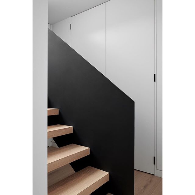 Stair detail at our Albert Park Project 🖤 We used our &lsquo;Sandstorm&rsquo; flooring from @kustomtimber to wrap the stair treads - this helped in creating continuity throughout the house.. and a custom steel balustrade completes the look! 
Building Design &amp; Construction @thealbertparkbuilder 
Interior Design &amp; Styling @dotandpop 
Style Assist @aboutkp 
Photography @simonshiffsays